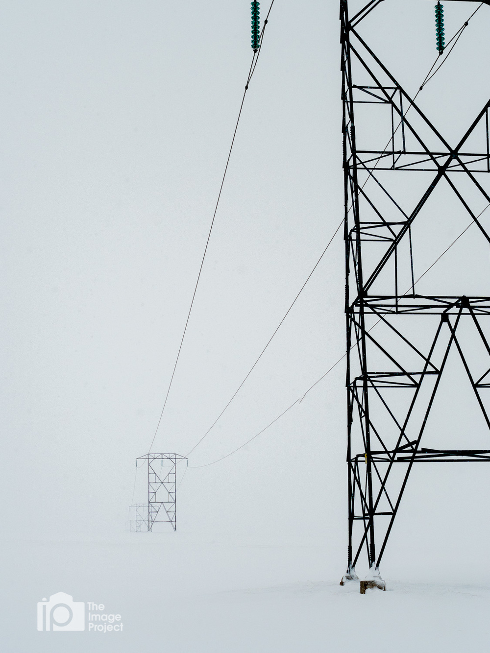 pylons during snowstorm whiteout north iceland by nathan barry the image project winter