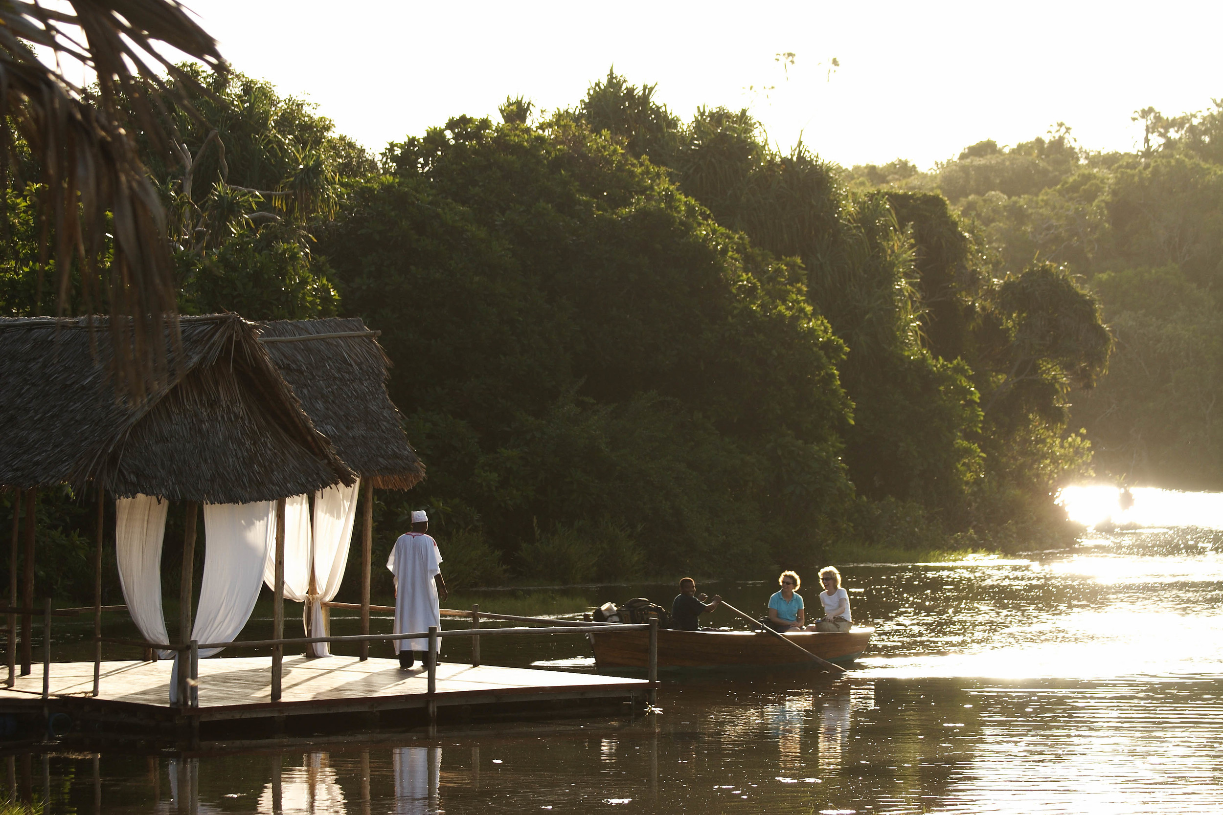 Arrive on our airstrip and rowed across the lagoon towards camp.jpg