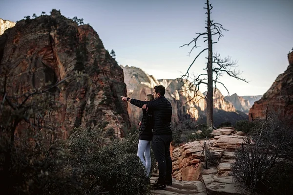 Couple at Scouts Landing in Zion National Park Utah for their red rock engagements