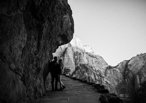 Hiking in Zion National Park for their desert engagement session.