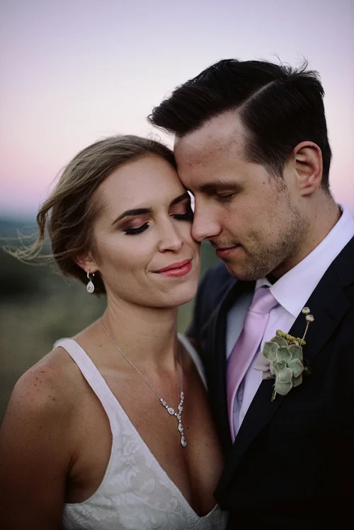 bride and groom together at sunset