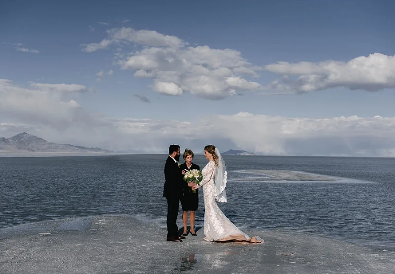 Couple holds hands at their elopement at the Salt Flats