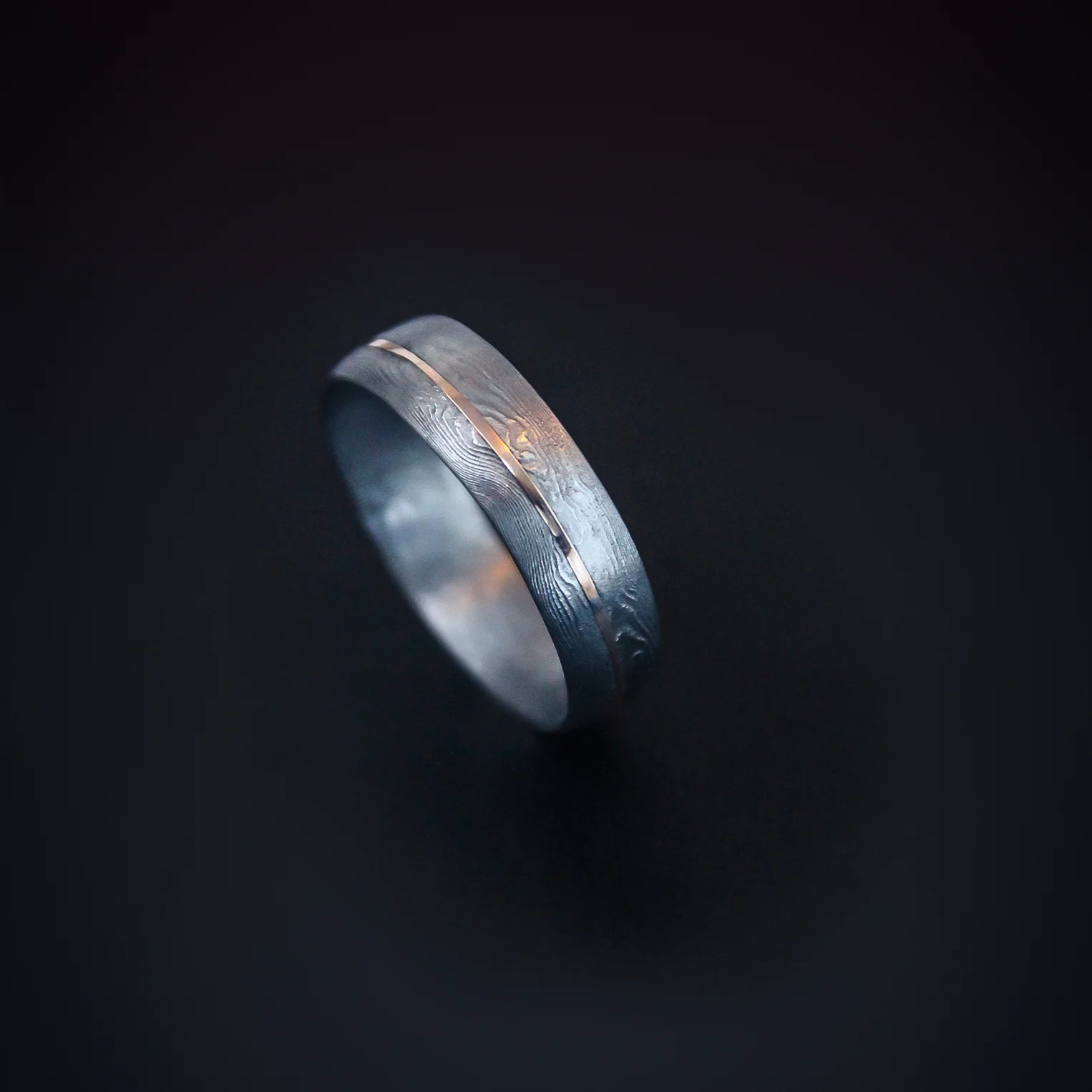 Carbon Damascus steel wedding rings 18ct rose gold inlay