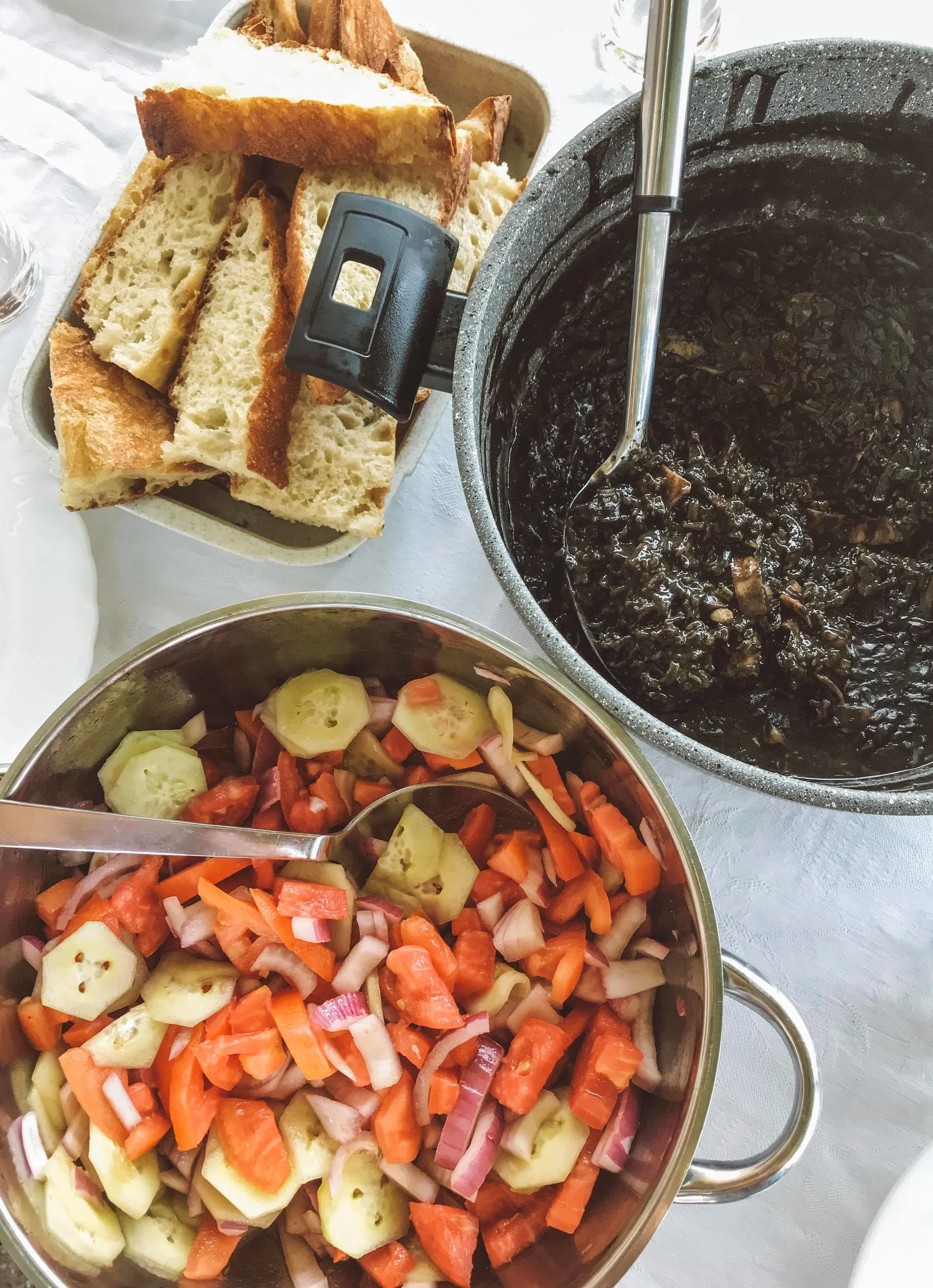 Crni rižot - black cuttlefish risotto. A popular dish in the Dalmatia region, which gets its trademark black colour from the addition of squid link. Served with a salad, and fresh bread to wipe your plate clean with!