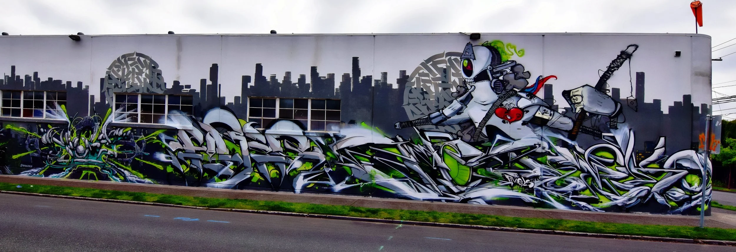 In-progress mural along NE 21st Avenue, managed by Galen Malcolm of PSAA. Art along this wall included work by EKOSE, NEKON, NOTES, ADJUST, GIVER, VIDEO, FIBER, ABNR, KANGO, and Level Headed Press. Photo: Paul Landeros
