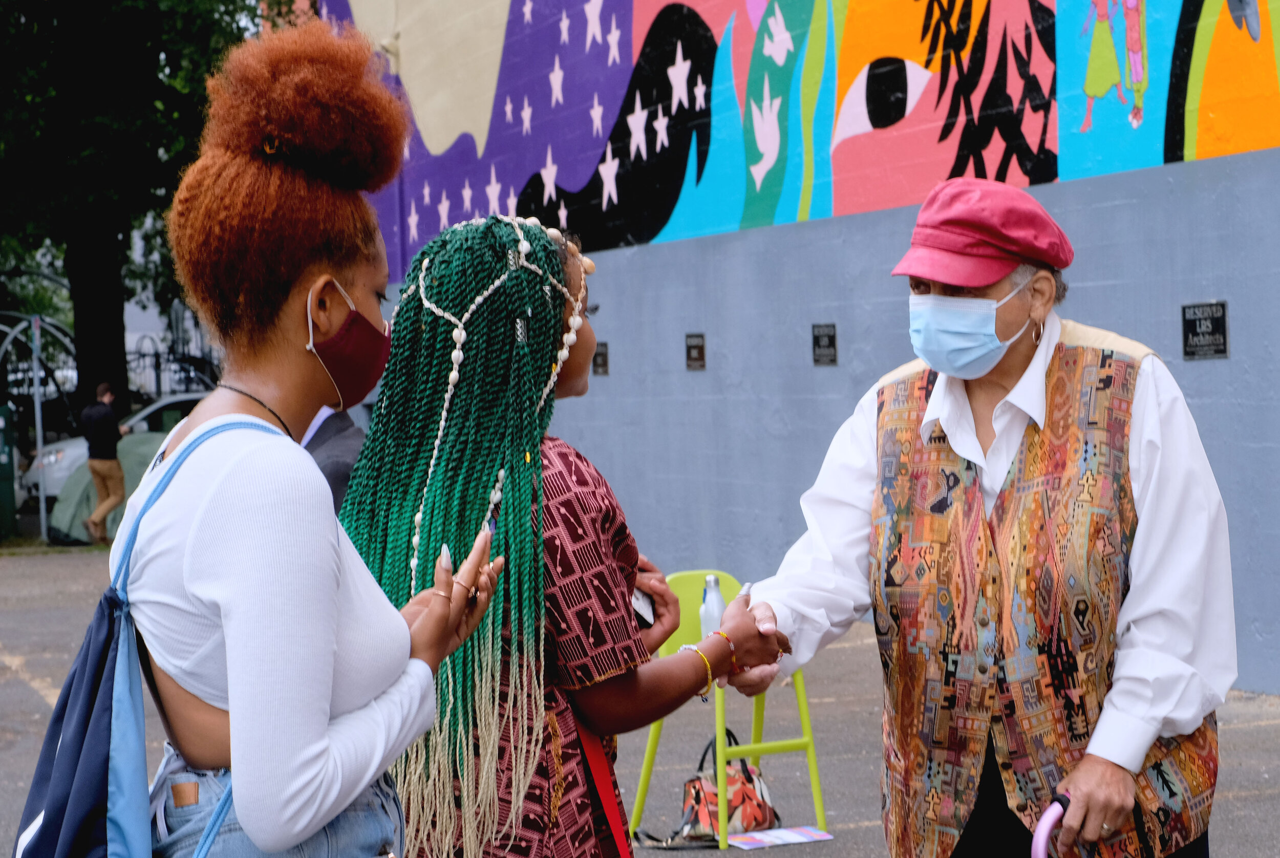  Tommy Mack-Davis (Nafsi) greeting honoree Kathleen Saadat 