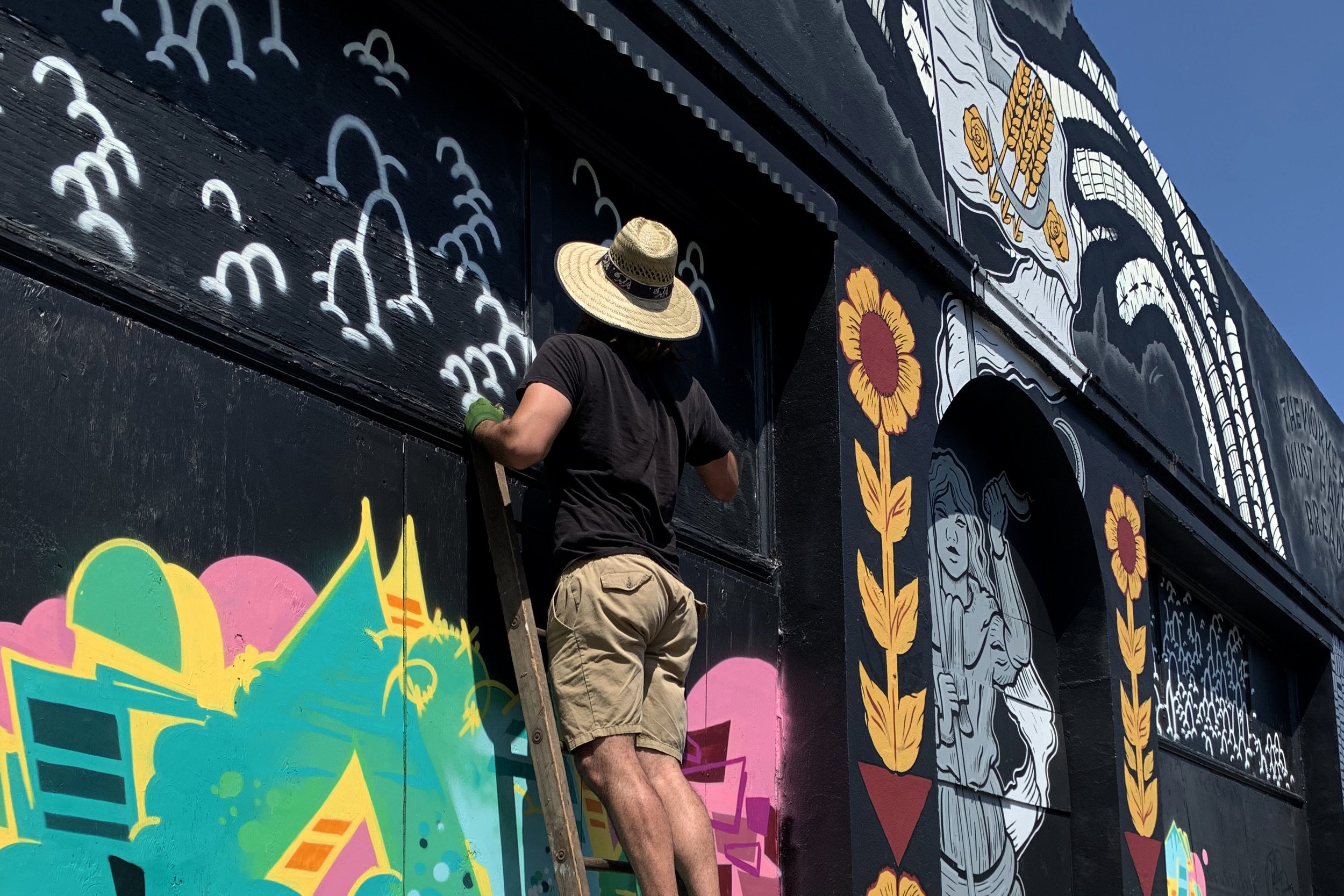 Jeff Sheridan painting at Bread and Roses Mural 2019.jpg