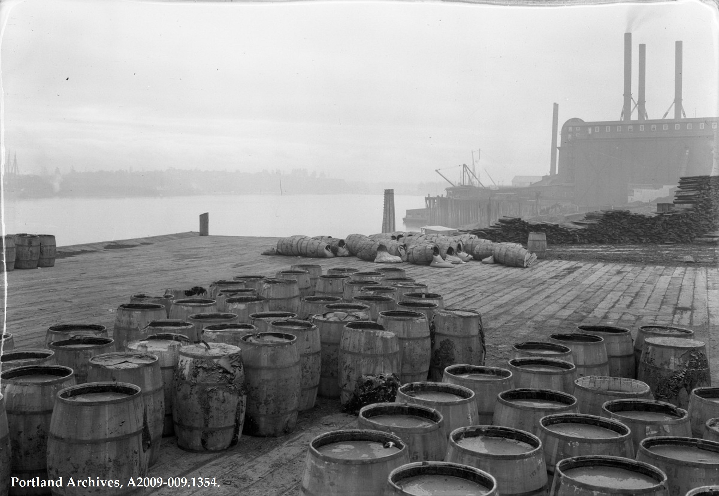 1 - Barrels on Dock - Public Works Administration (Archival) - Public Works Administrator - Photographs - A2009-009.1354   SW Jefferson St 1924.JPG