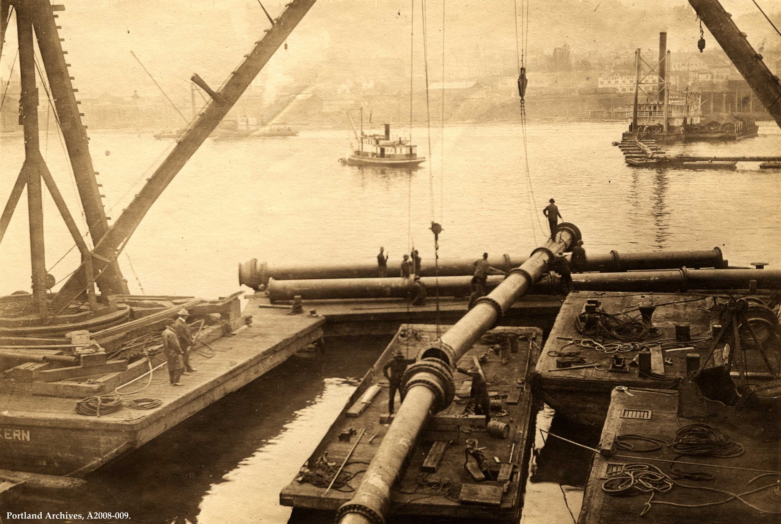 Water Bureau - Water Bureau (Archival) - Photographs - Willamette River conduit crossing with barges and pipe assembly 1910.JPG