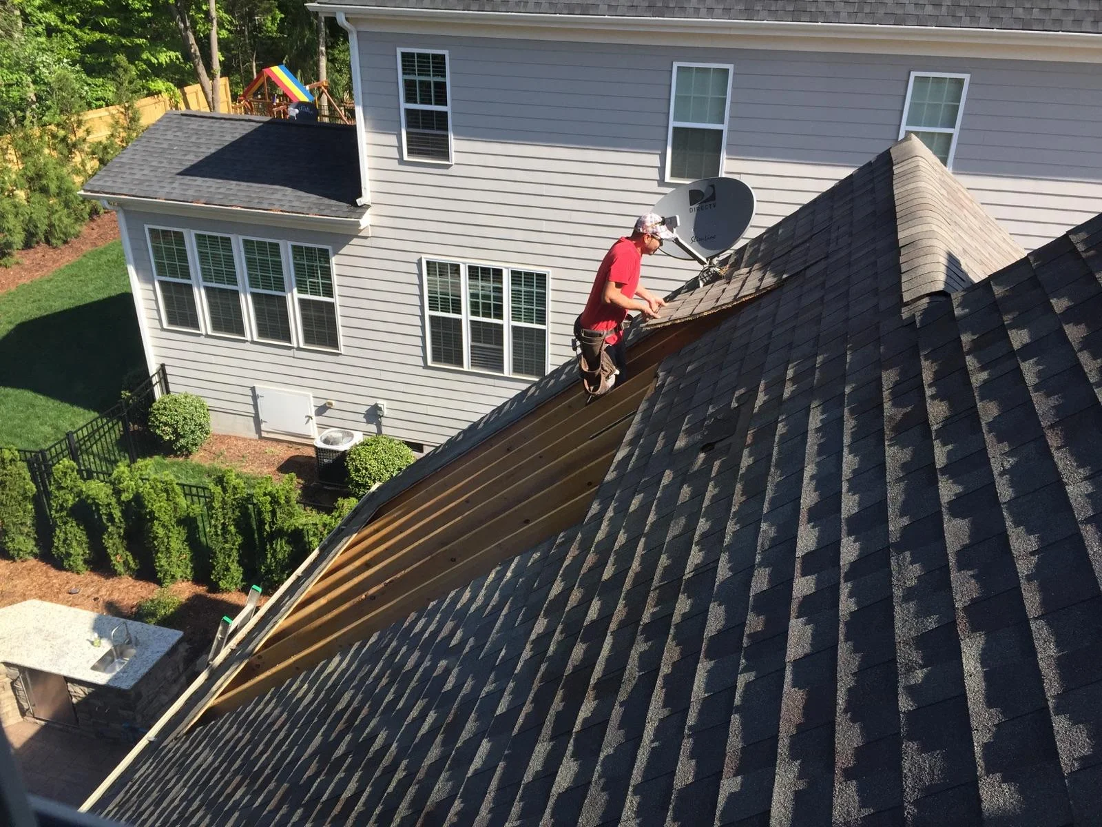Opening the roof. Demo of existing roof shingles and sheathing.