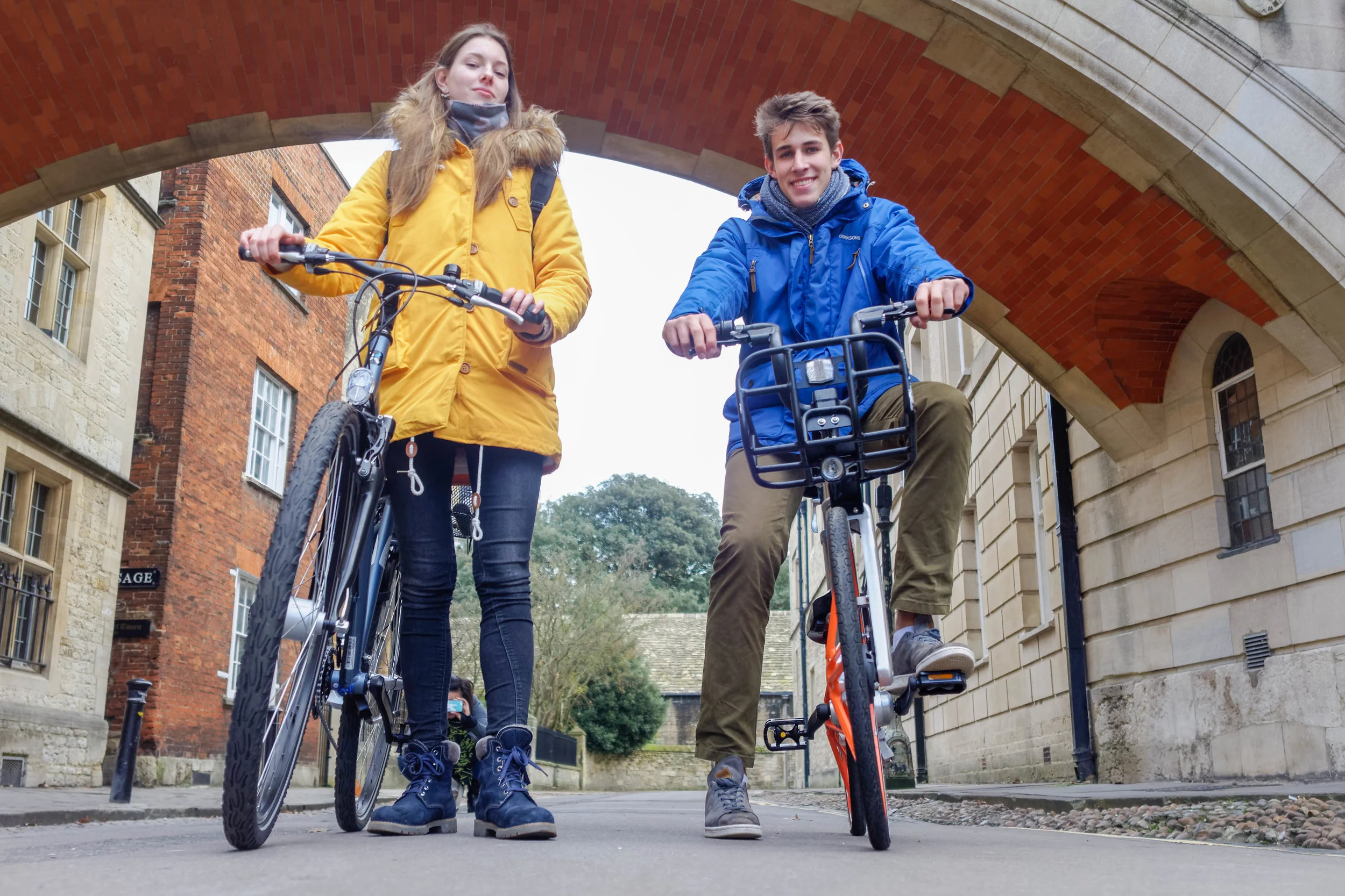 Cycle.land interns Anja and Max, featuring one of our community bikes and a mobike.