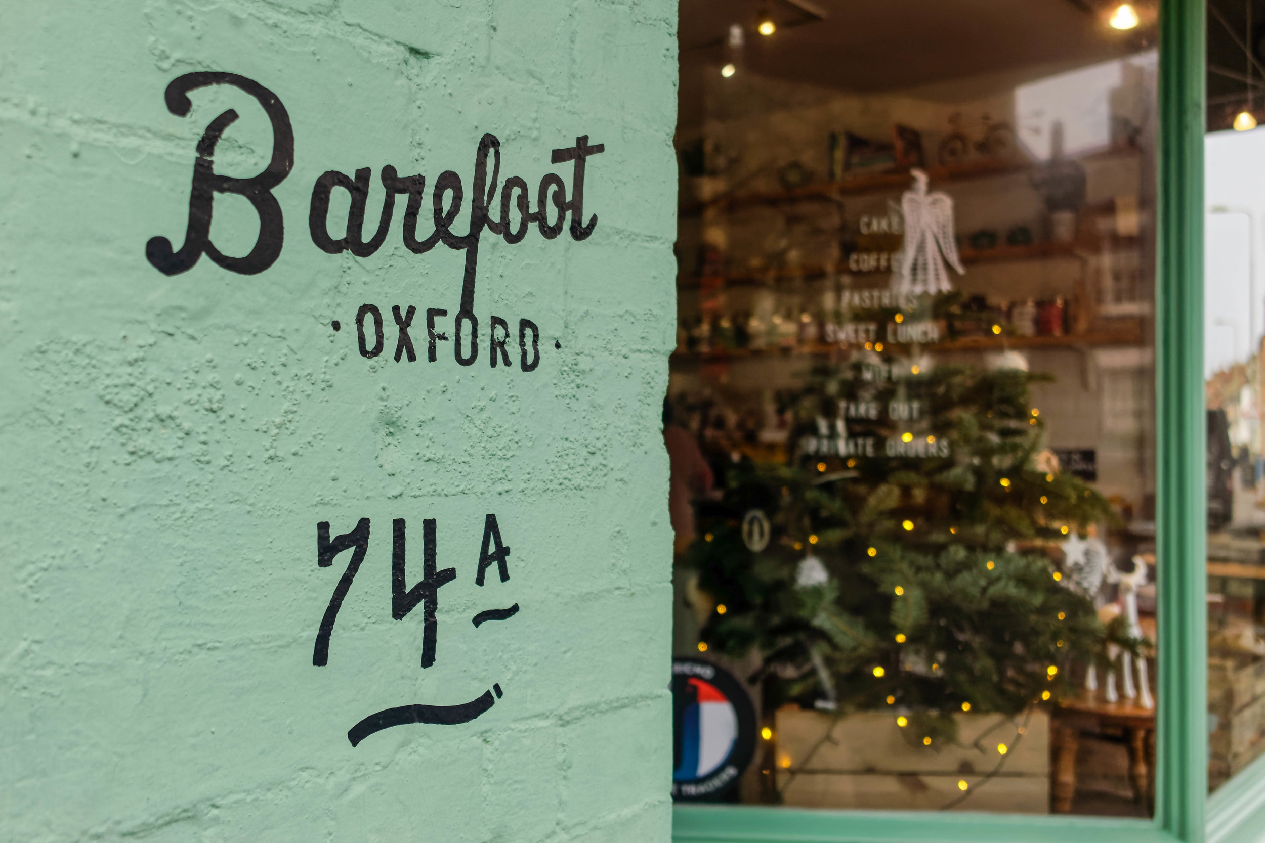 Barefoot’s unmistakable seafoam green front features a small Christmas tree beside the usual selection of cakes and breads.
