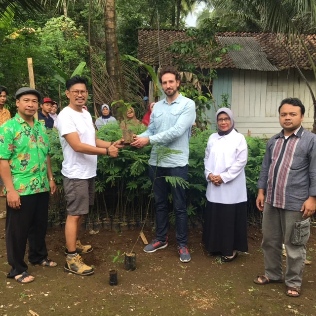 Surrounded by local farmers.