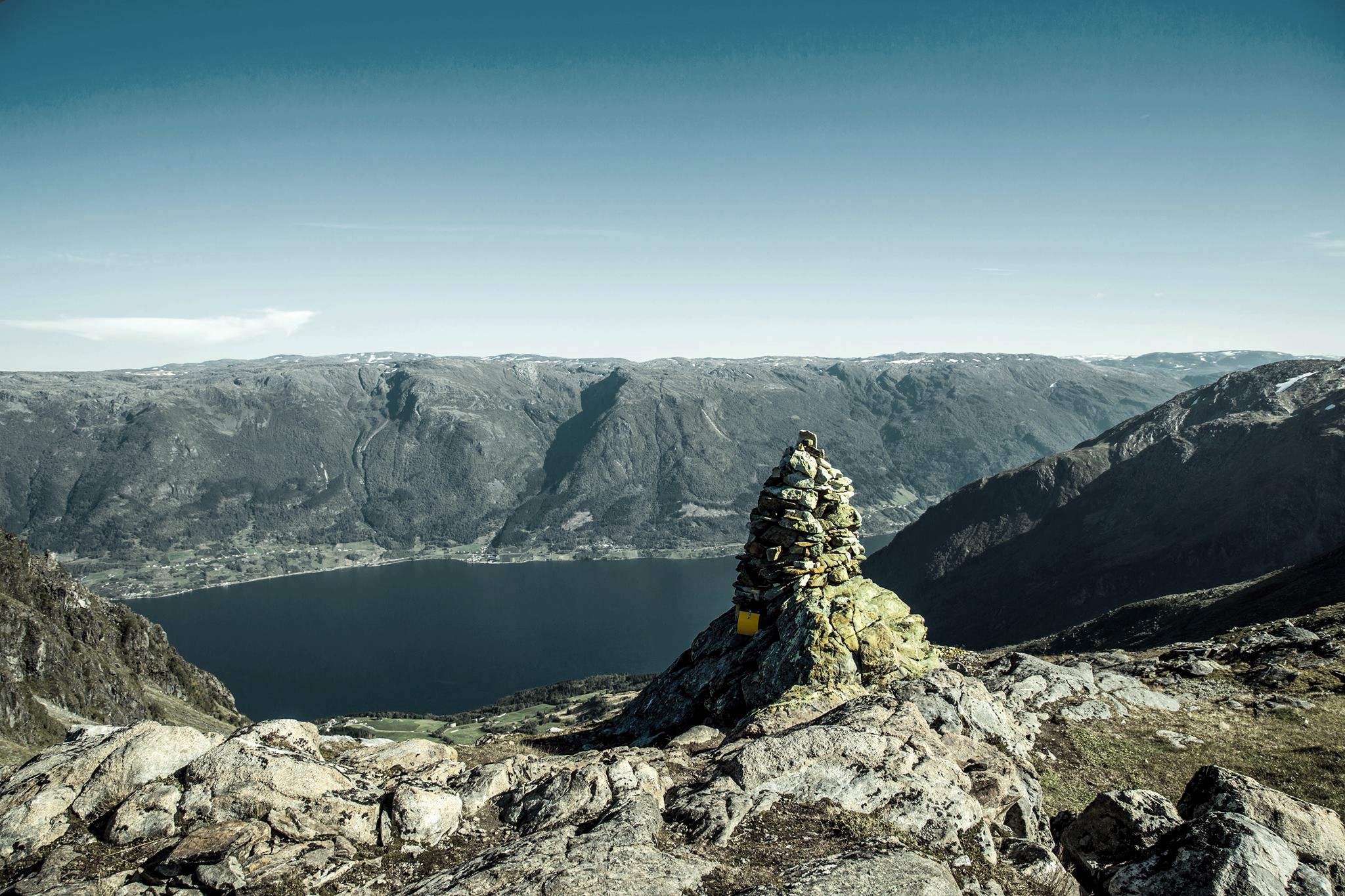 The cairn at the edge of the mountainside, marking the spot where The Cattle Trail reaches the Folgefonna plateau, 1200 meter a.s.l.