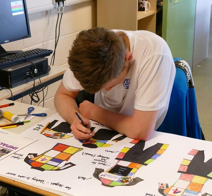 Lewis works on his design at Hinde House School
