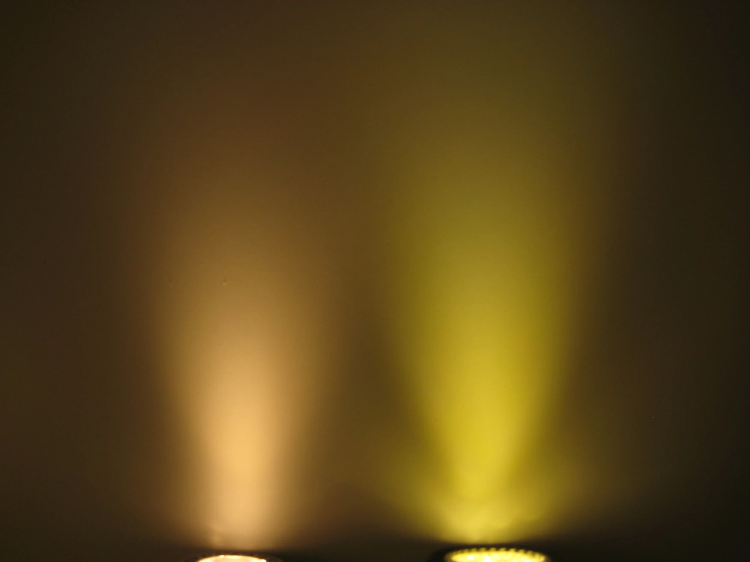 Two retro-fit LED lamps compared side by side. Both are labelled as 36 degree beam angle and 3000K colour temperature. In reality the lamps are less yellow than the photograph suggests but the difference between both lamps is very significant nonetheless.