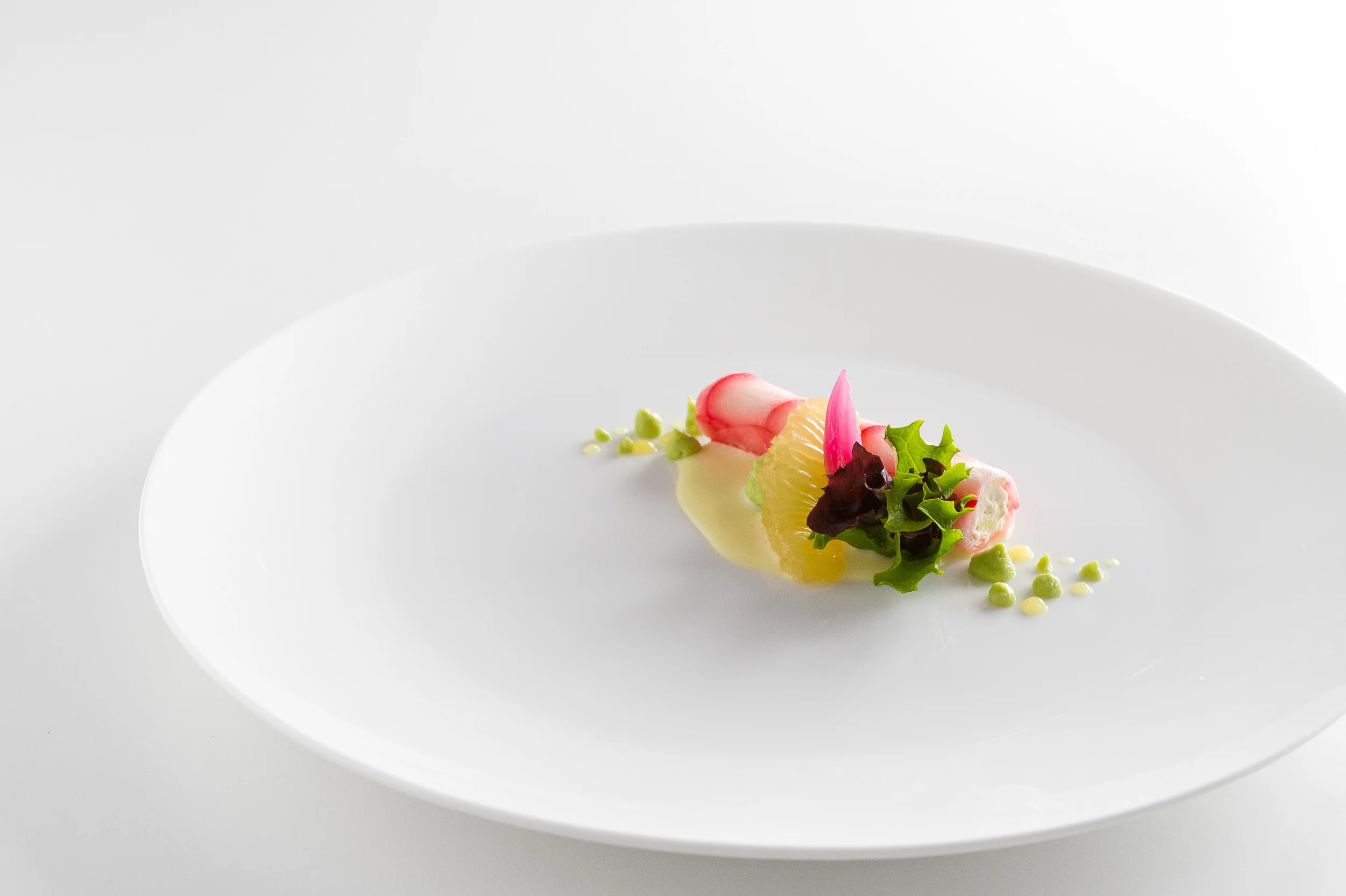 Radish cylinder filled with tarragon creme, lemon puree, lemon dressing and fermented red onion