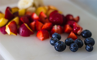 The Smoothie Bowl Recipe That Will Change The Way You Eat Breakfast Just when you think you’ve tried every possible smoothie recipe on the planet, along comes something called the “smoothie bowl”. Your Instagram feed is filled with them and lifestyle bloggers are raving about them - so what’s so special about these so-called smoothie bowls anyway? Despite the fact that they look like beautifully crafted pieces of art - these little beauties are filled with so much healthy goodness - that we can’t help but embrace this healthy trend! INGREDIENTS Smoothie base : 3/4 to 1 cup almond milk 1/4 cup of ground flaxseed 1 Tbsp organic coconut oil 1 cup fresh or frozen berries (we used a mixture of blueberries, blackberries and strawberries ) 1 cup of fresh organic spinach 1/2 cup ice Topping 1 large banana, cut into thick slices 1/4 cup fresh berries (blackberries, raspberries and/or strawberries) 2 tsp of sliced raw almonds (crushed walnuts or pecans would also work) 2 tsp of raw pumpkin seeds 1 Tbsp of dried goji berries 1 Tbsp of chia seeds 1 1/2 Tbsp of your favorite organic granola and/or desiccated coconut flakes Instructions Place almond milk, flax seed, frozen berries, spinach, coconut oil and ice in a blender. Blend until smooth. If you have trouble blending, add more almond milk as desired. Place smoothie mixture in a medium bowl. Top the smoothie bowl by adding the remaining fruit, berries, nuts and other desired ingredients. Use your own creative flair! Serve immediately & enjoy. 