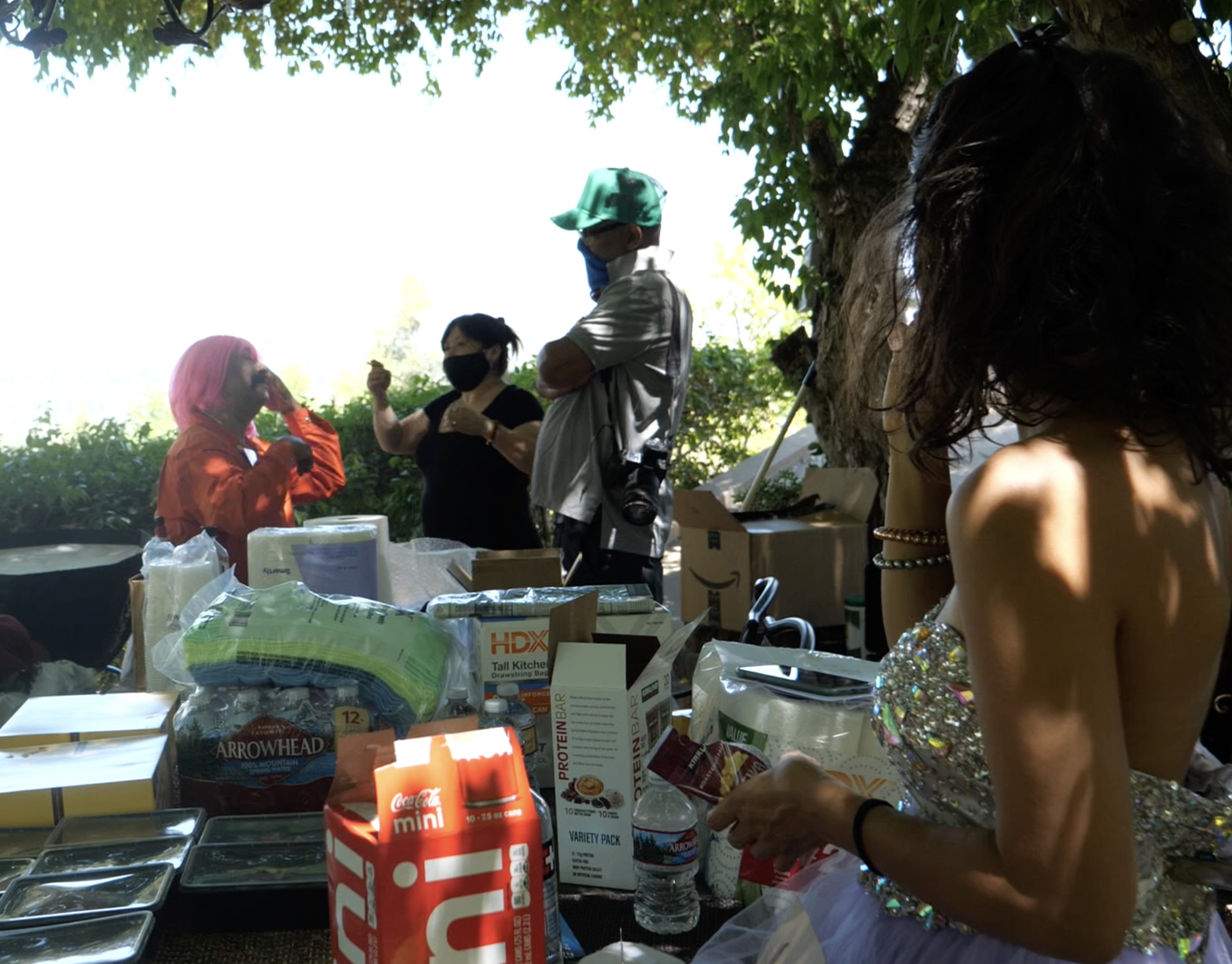 Alejandro Patino as Lydia Chlamydia, Ruth Martinez doing makeup and hair with director Juan Escobedo and Gabriela Milla looking on.