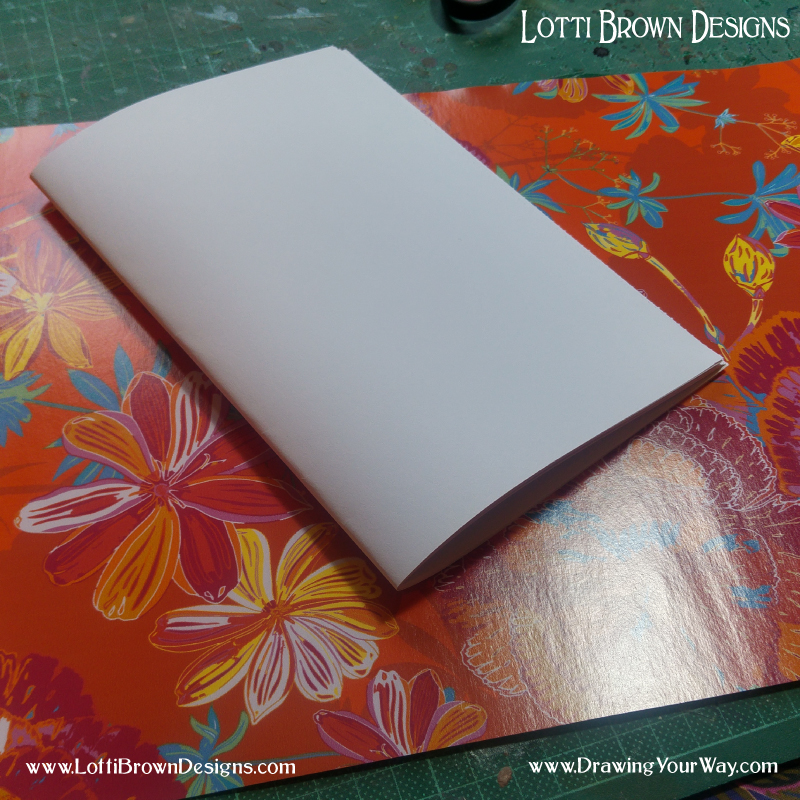 Fold papers to make the pages for your sketchbook