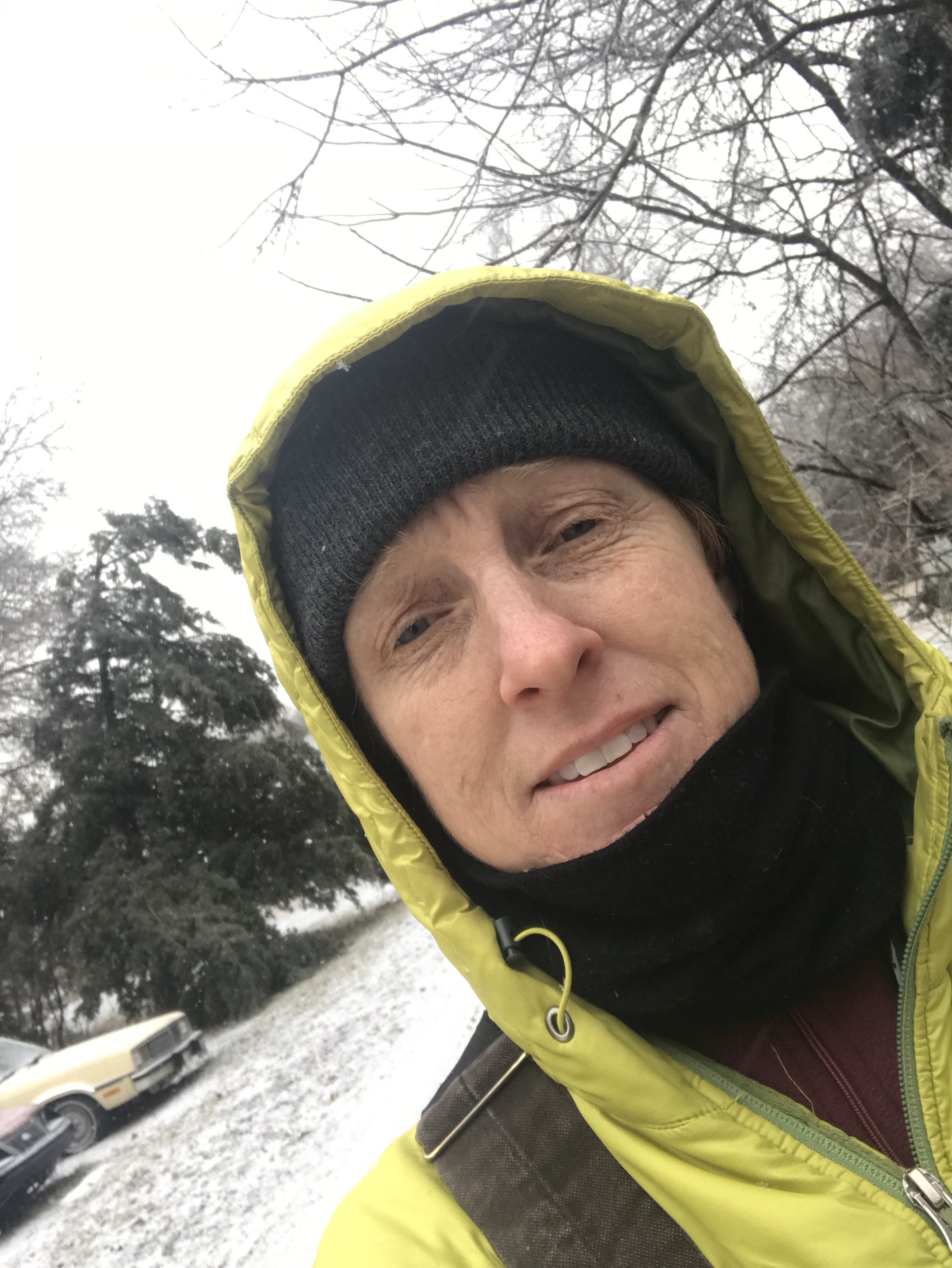 Maggie bundled up to do winter chores at her own farm, where she cares for three horses, one mule, three chickens, one dog, three cats and three humans.