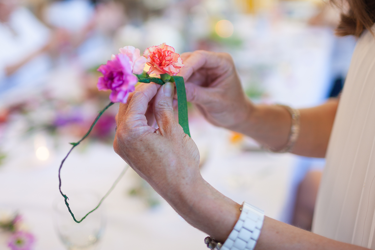 Flower crafts at an evening event.