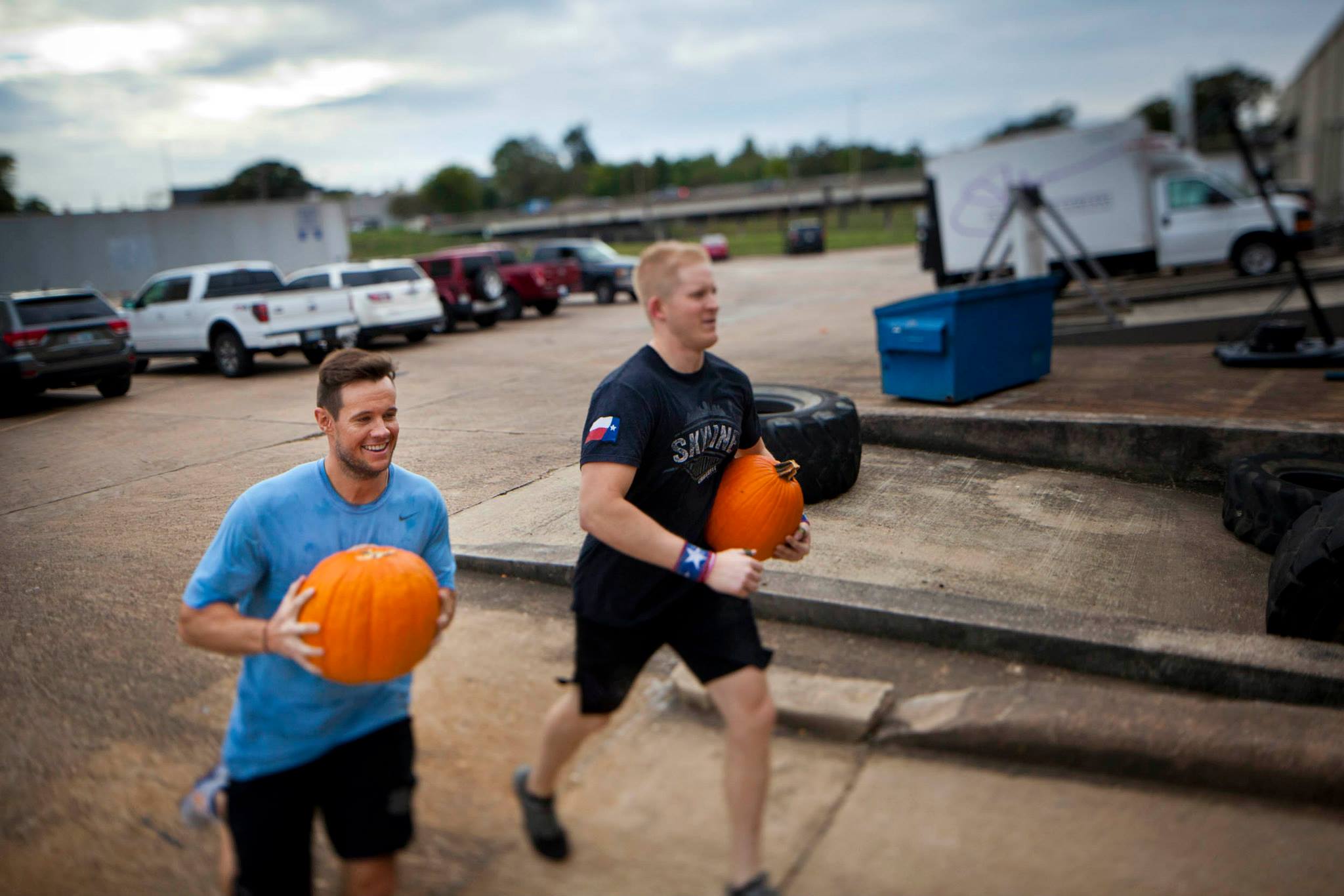 Greg and Daniel at the Halloween WOD. You try to run with a pumpkin and not smile. 