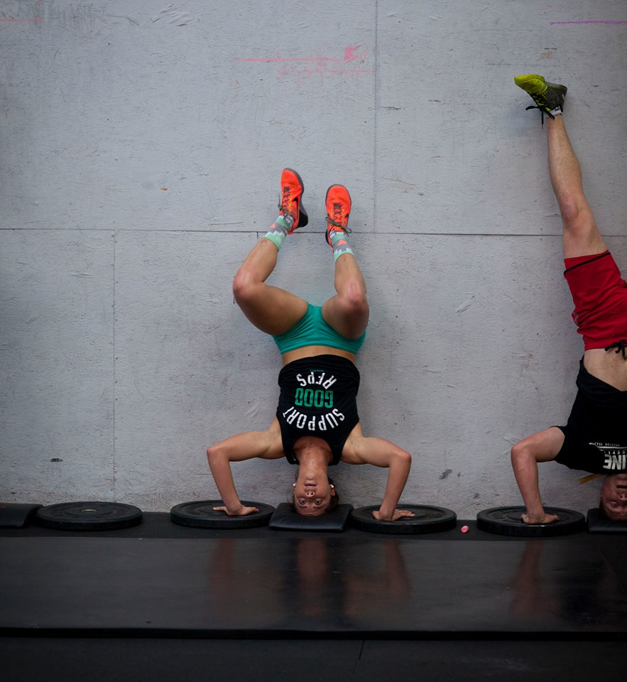 Calsie and Mike knocking out some Handstand Pushups.