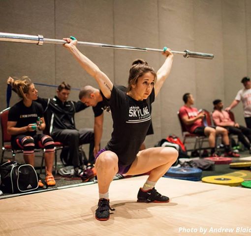Bethany warming up at Nationals with Team Skyline in the background.