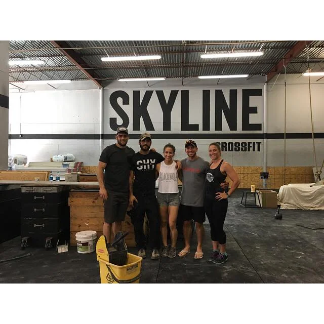 Dylan, Bethany and Heather with Dan Bailey during the construction after the flood damage.