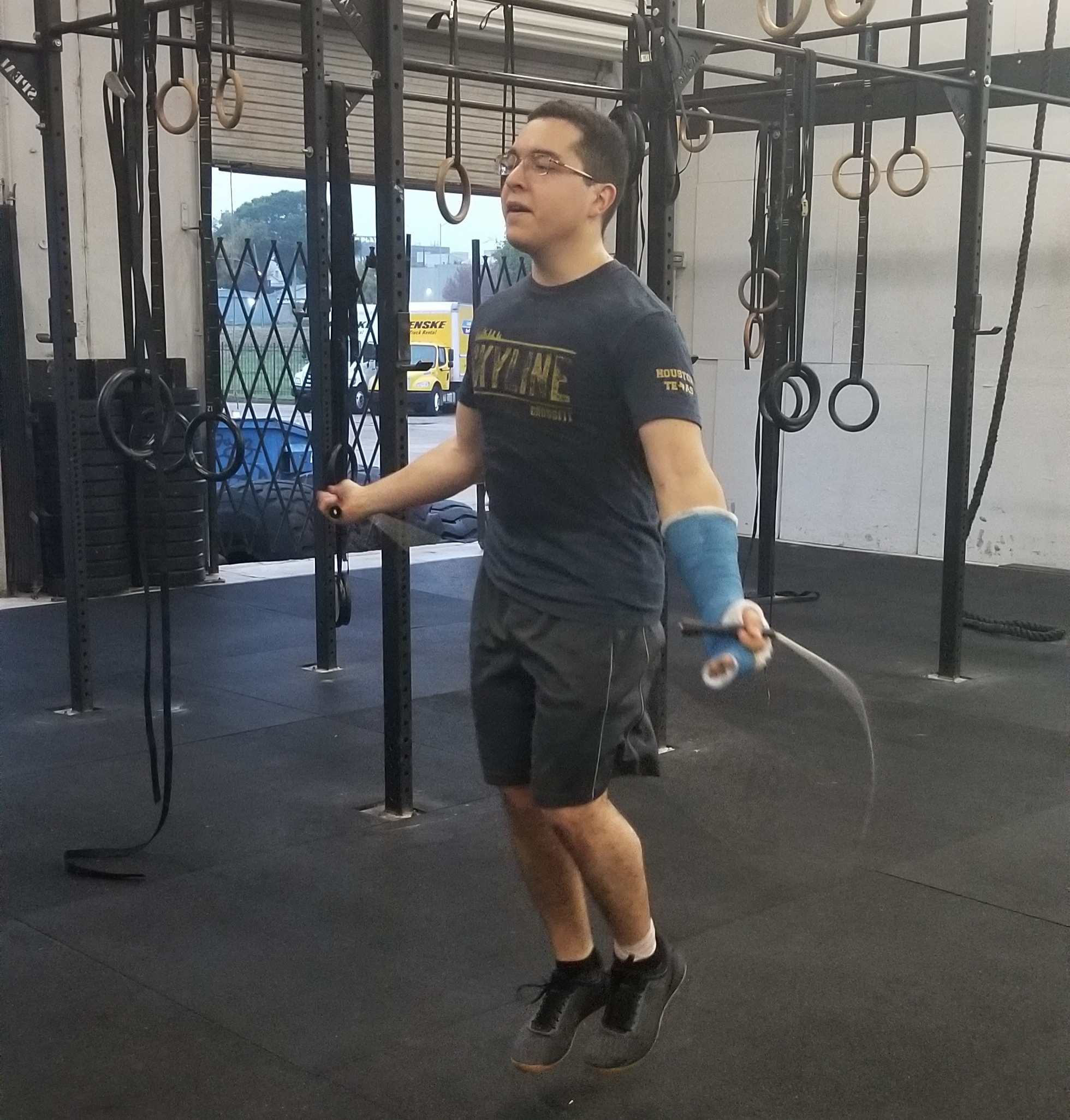 Christian Carrion a avid 6am goer that recently broke his hand. He doesn’t let this stop him from coming to class and scaling the workout to his ability. Double-unders are a little tricky with a cast so Christian is seen here scaling with single-unders. Scalability is our expertise, don’t let injuries stop your routine, talk to the coach and we will get you moving in no time!