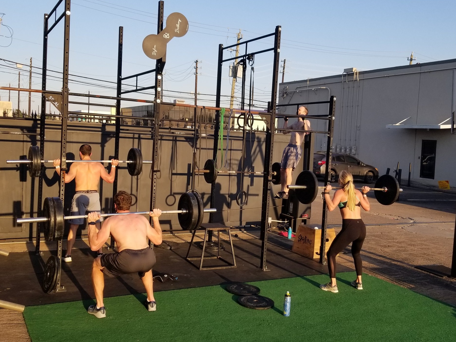 John, Connor, Liz, and Eric getting some sun on the outdoor rig during evening classes.