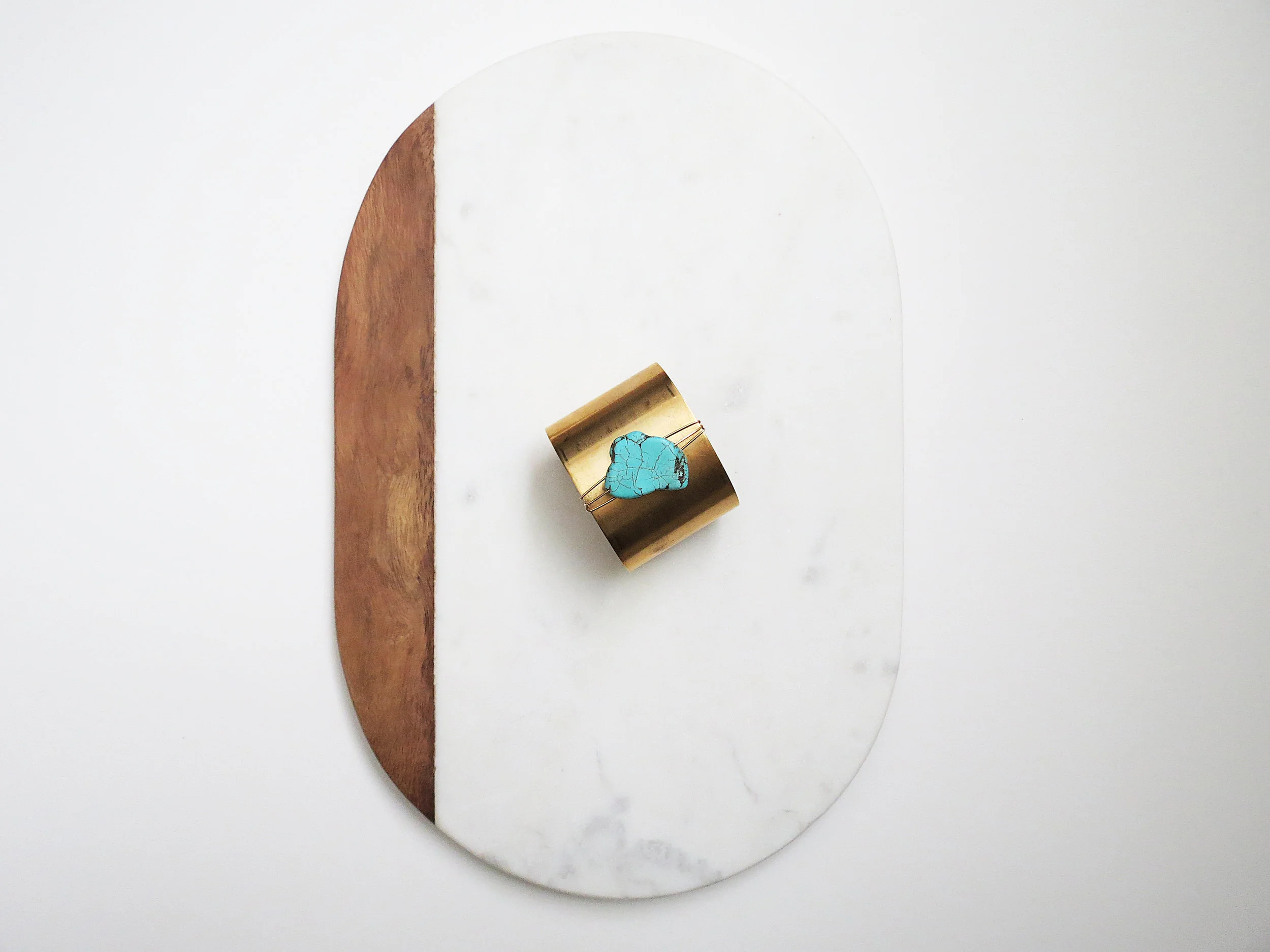 Turq Curve minimal modern handmade jewelry gold raw brass, gold-filled wire + turquoise howlite cuff bracelet overhead view