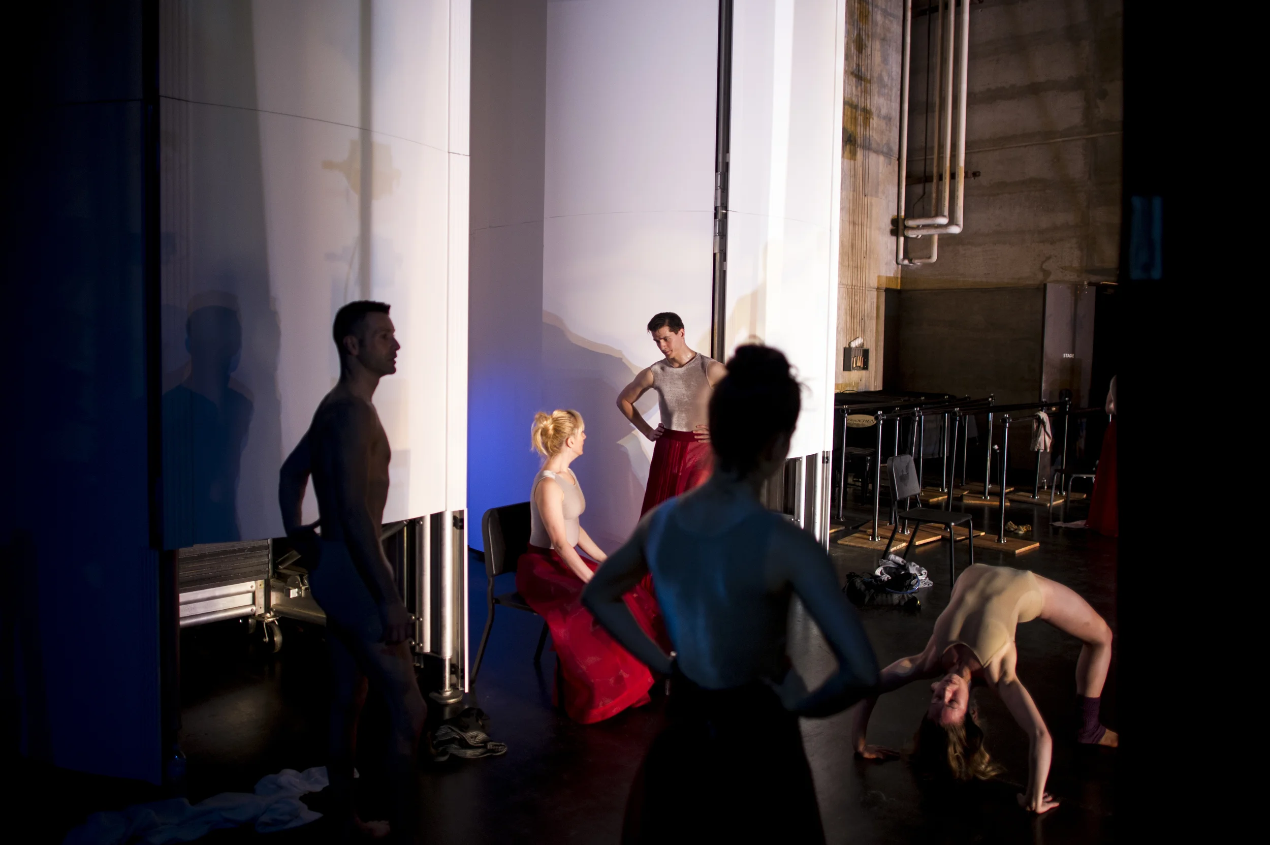 Modern dancers backstage before a performance.