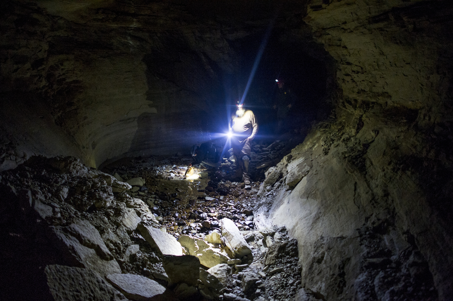 Chris Clark, a Mammoth Cave National Park employee, continues through Bat Cave, named for the hundreds of years of bat bones found here, a sign that it was once a large hibernaculum.