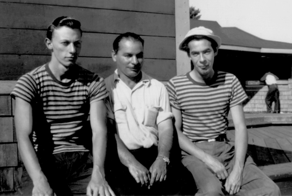 The rocks and shoals of Georgian Bay ensured that Albert Desmasdon (above, between two bellhops, and at work, below) was always busy repairing engines and replacing broken propellers. 