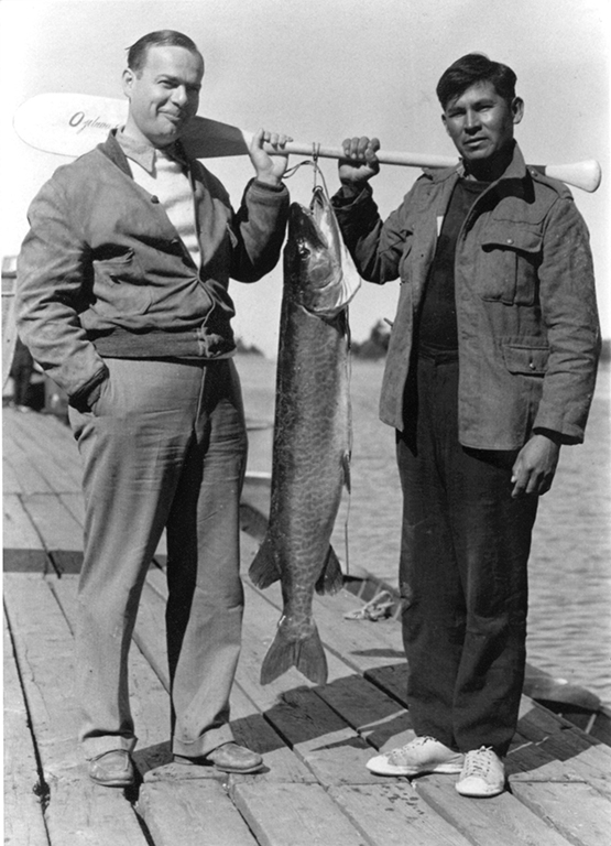  Fishing guide Frank Pegahmagabow, seen here with hotel guest Ted Stevenson. 