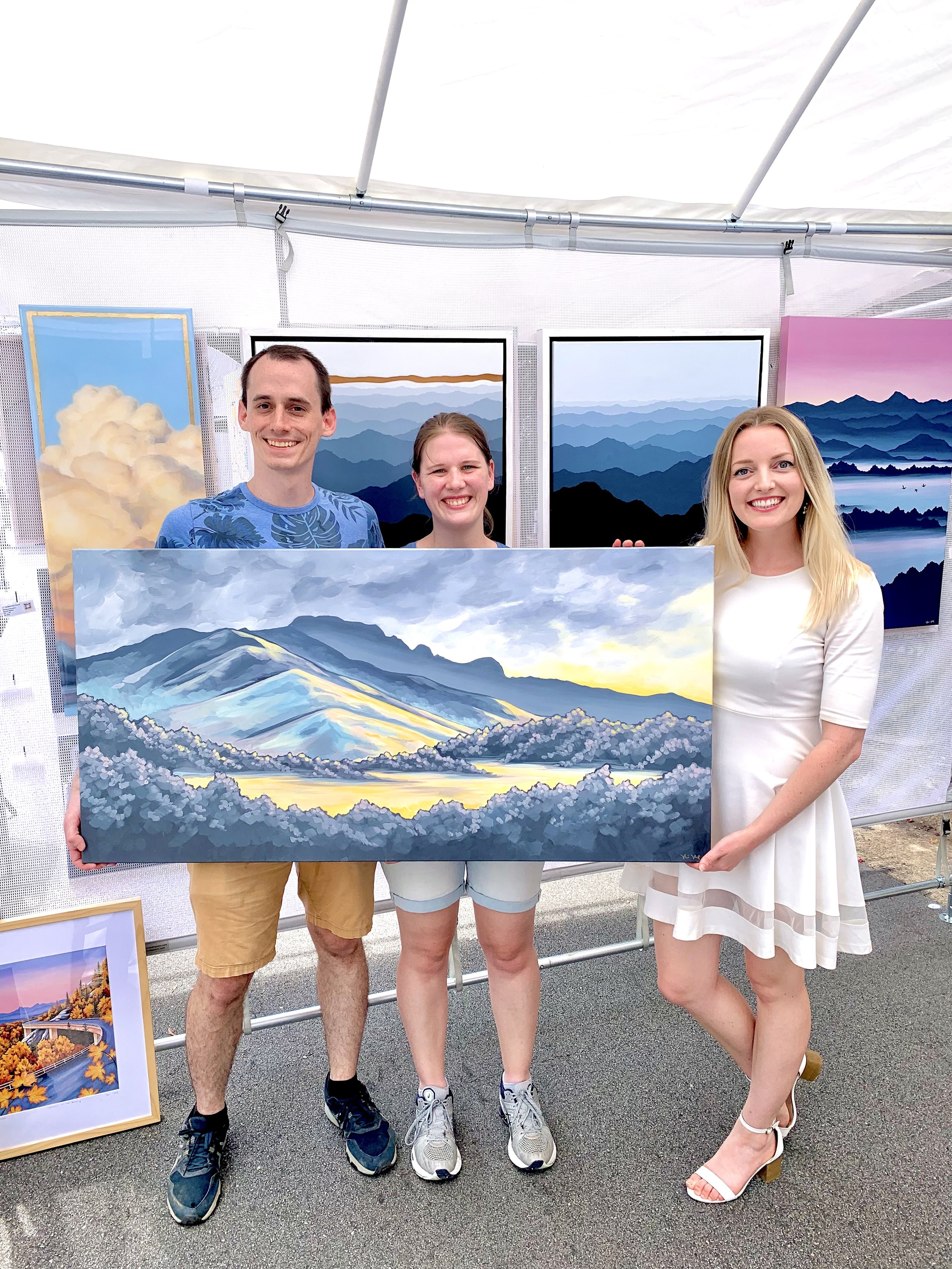 Collectors with their new piece "After the Storm on Grandfather Mountain"