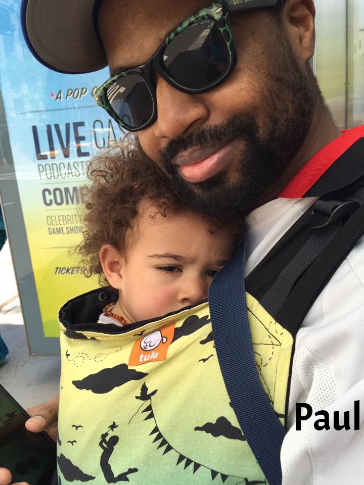 "Sleepy guy and daddy in the Bronx lending library's toddler Tula"