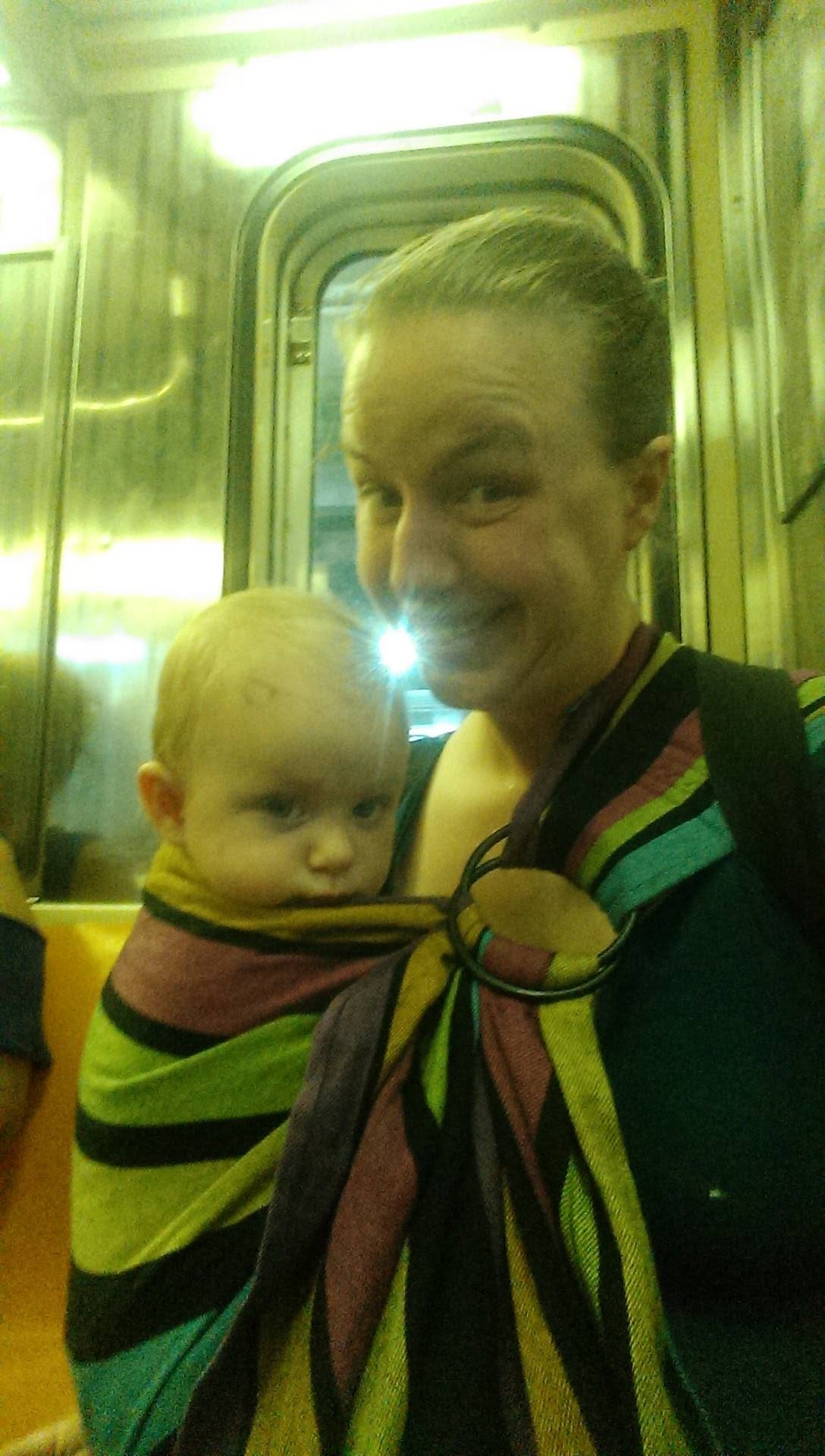 Judy: "On the 3 train, while sporting the Bronx Library's Ring Sling."