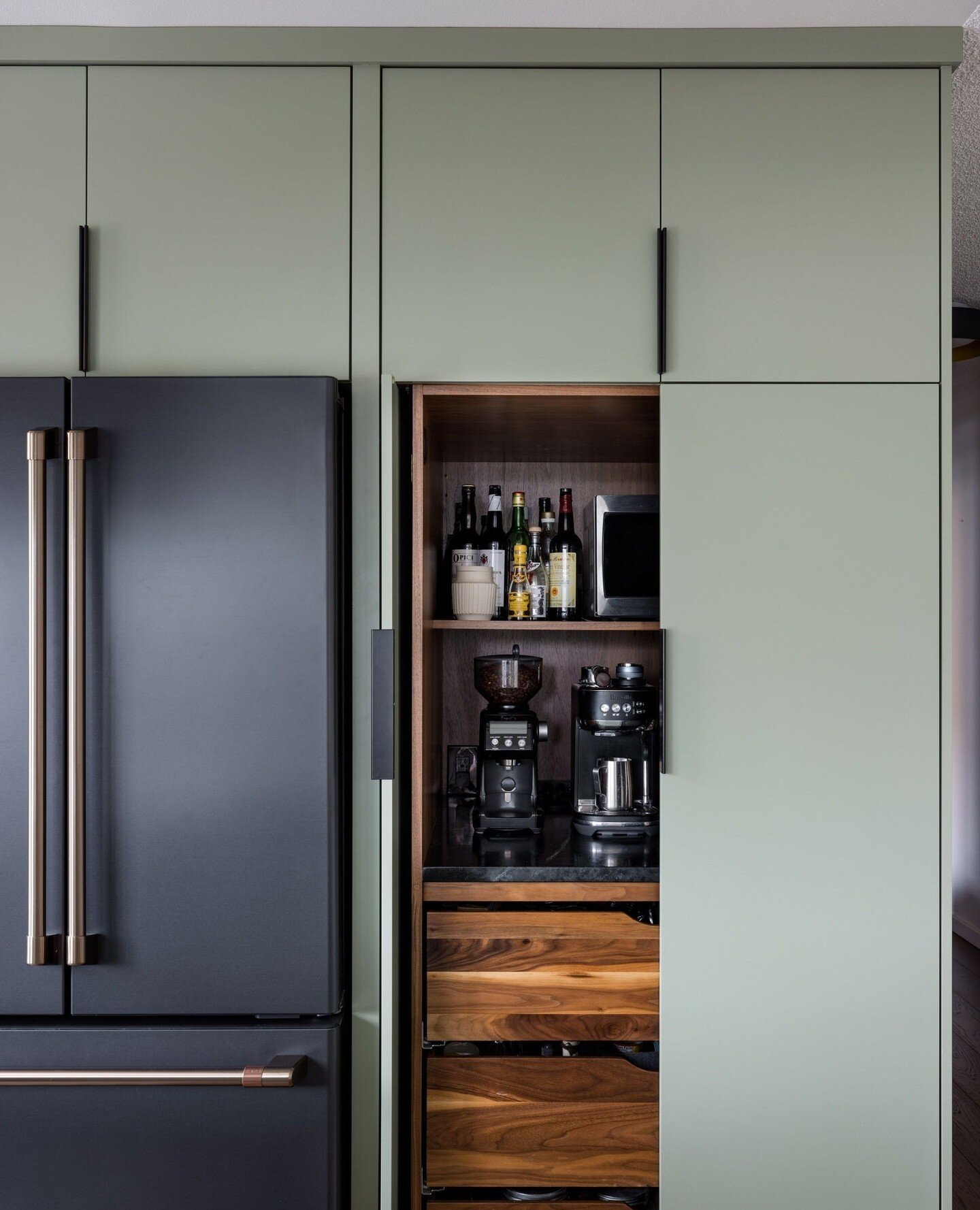 A peek-a-boo shot into the super pantry. A hard-working addition to the kitchen. Keeps small appliances hidden, but adds usable counter space. Win win.