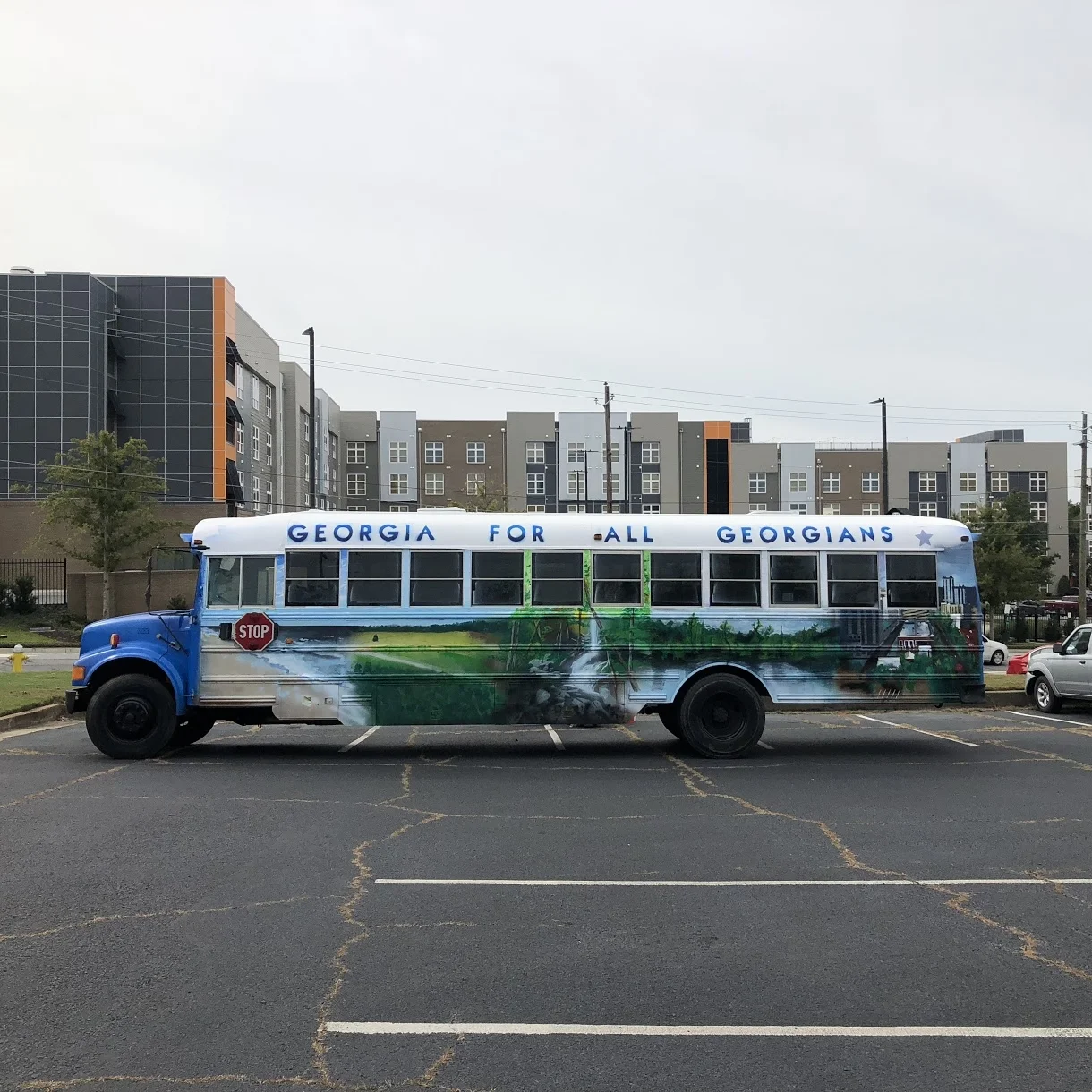 Hope for Georgia Bus — Left side wide viewI led this project, and completed it with the other four artist members of Living Melody Collective for Liliana Bakhtiari to paint a 36 ft. school bus to mobilize the vote in Georgia. Designed as a voting in…