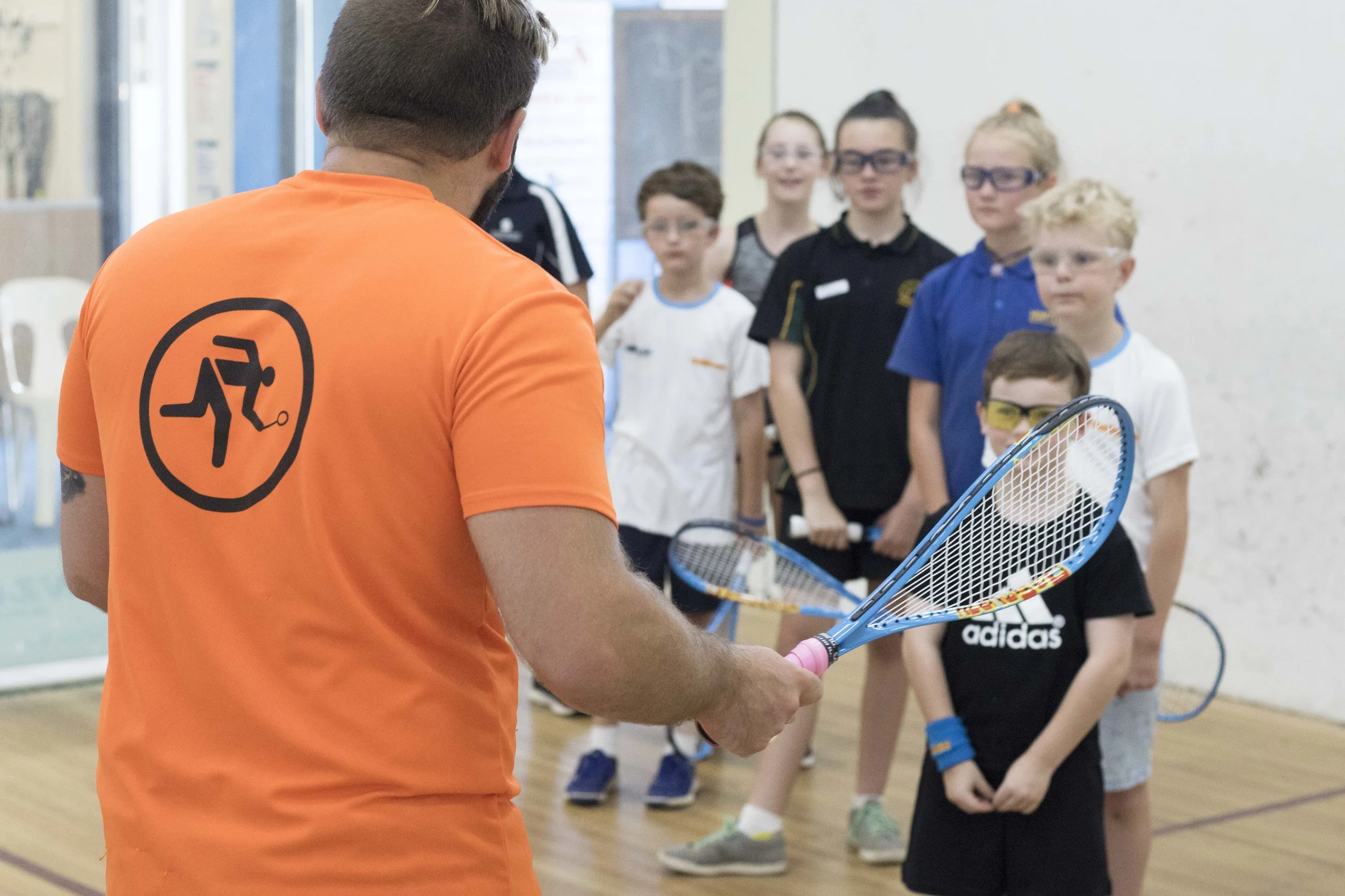 Group training for Juniors is fun and teaches them the basics of squash in a group environment