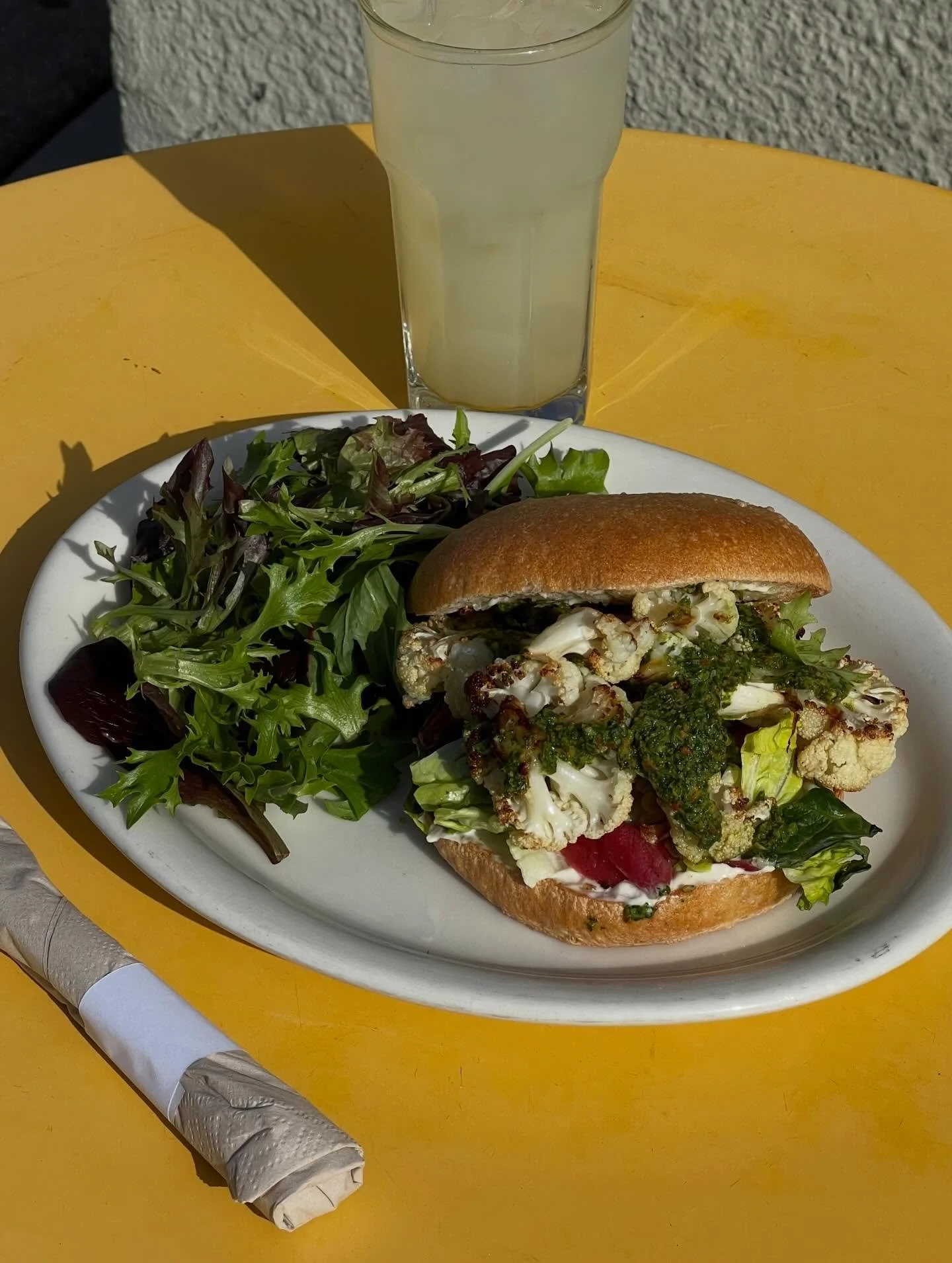 NEW! Roasted Cauliflower Sandwich with cilantro pesto 😋

Loaded with pesto, pickled red onion, romaine, tomato, and mayo on an acme bun