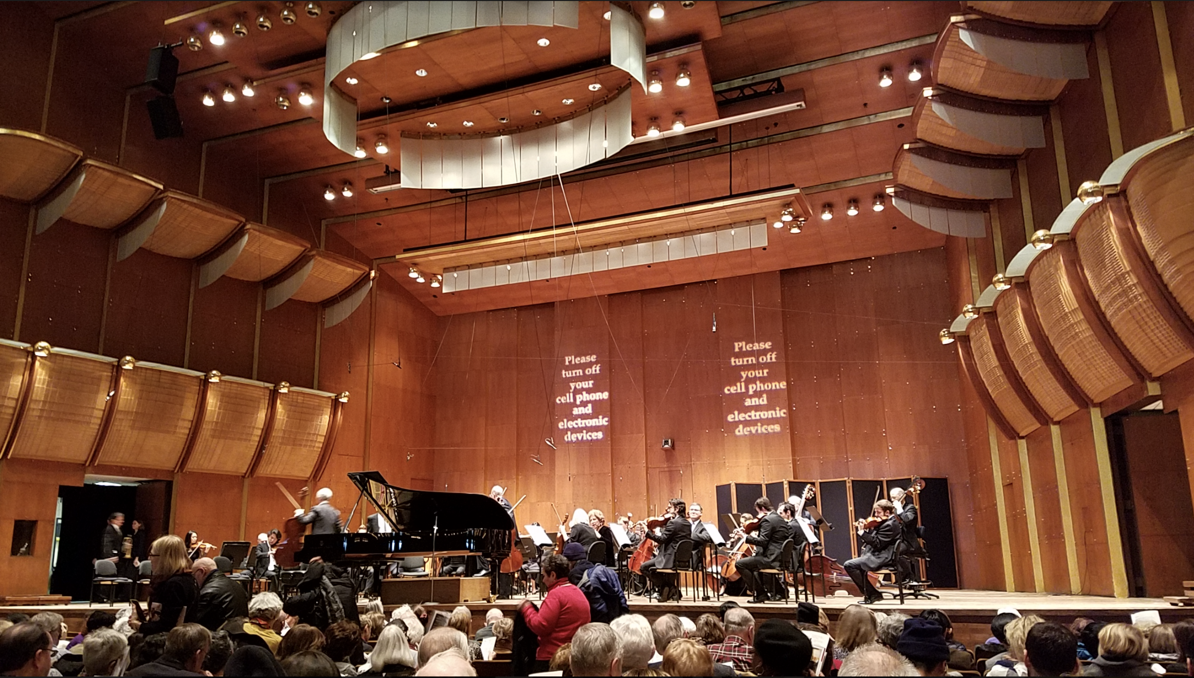 The tour group and the jazz band rejoined at the New York Philharmonic Concert to experience the professional performances of Beethoven and Piano Concerto No.1.