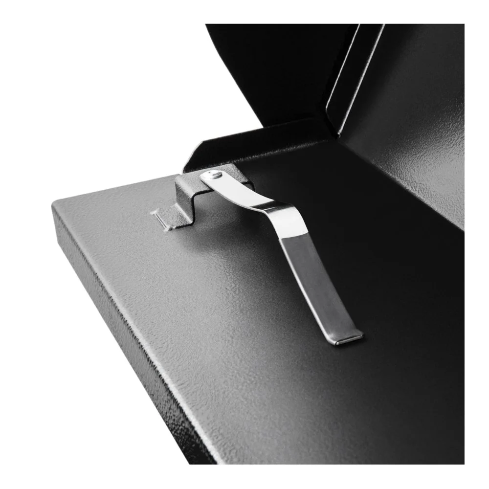 Close-up of a metallic latch inside a safe or locker.