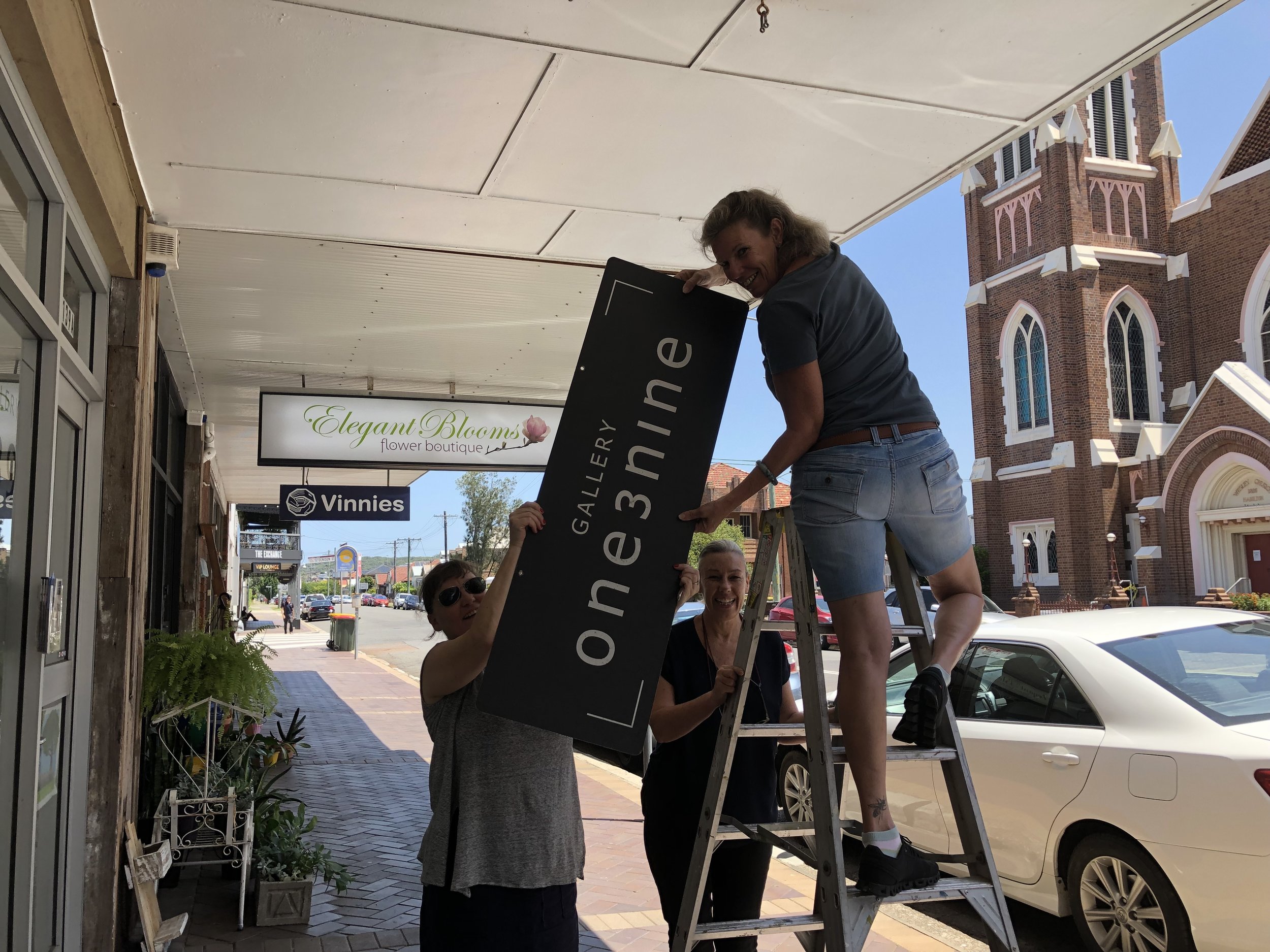Gallery 139 Volunteers (aka friends) helping to take down out Gallery 139 swing sign