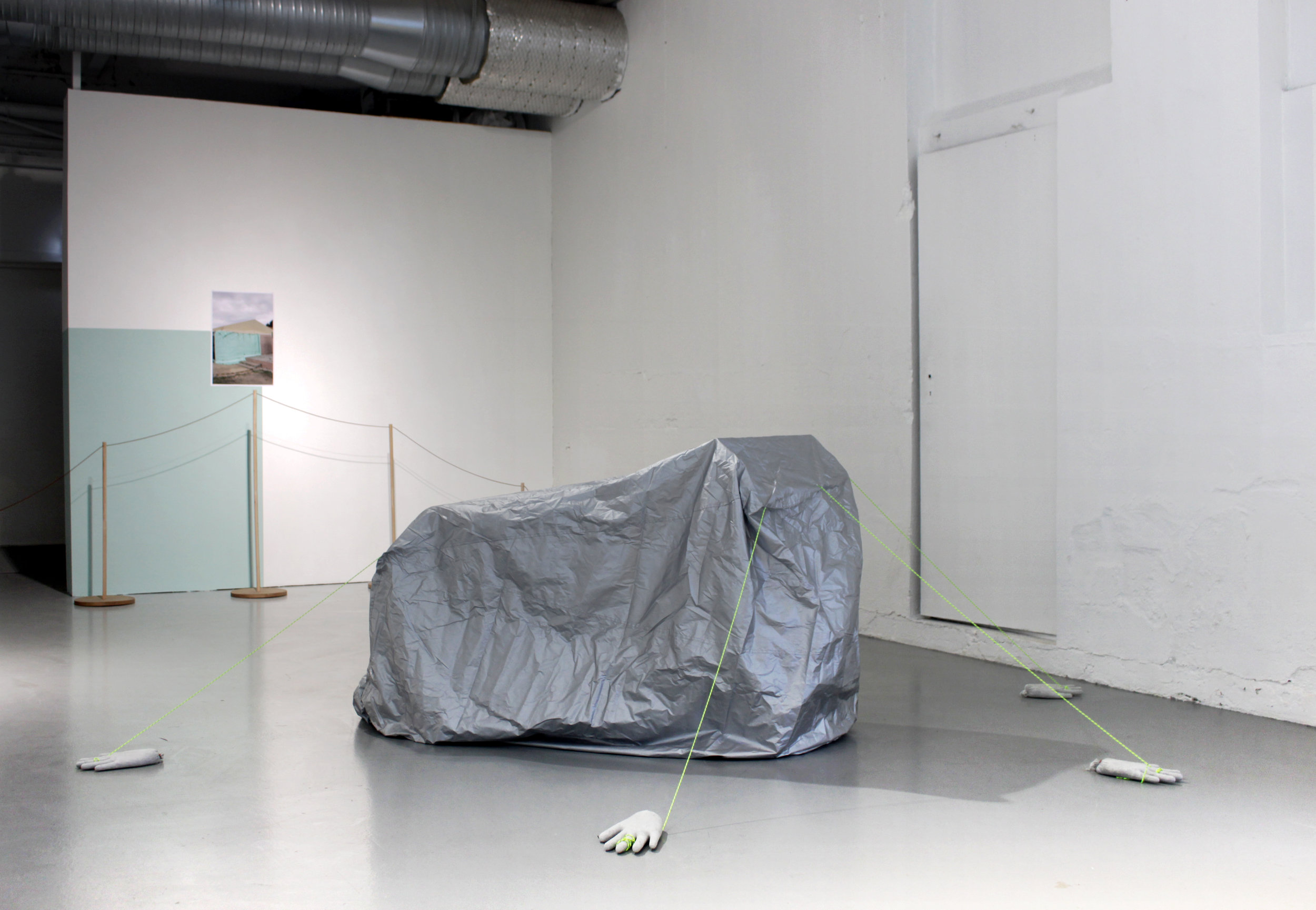 Untitled , 2018, dimensions variable, (motorcycle cover, cement hands, ropes). Foto: Audun Alvestad