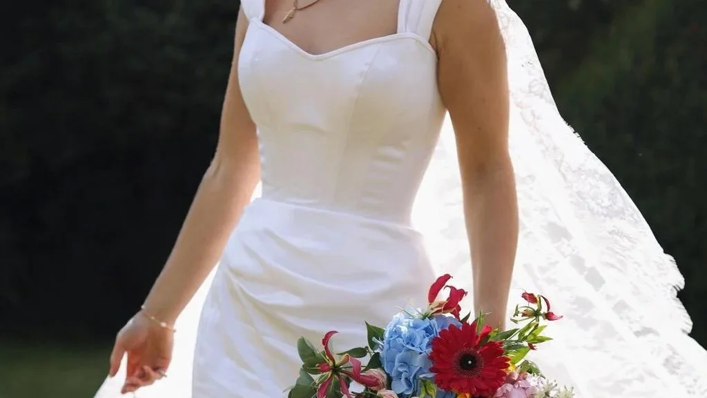 A bride wearing an Ivory Silk wedding Corset