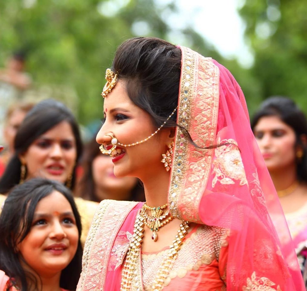Bride laughs as the groom enters the wedding venue